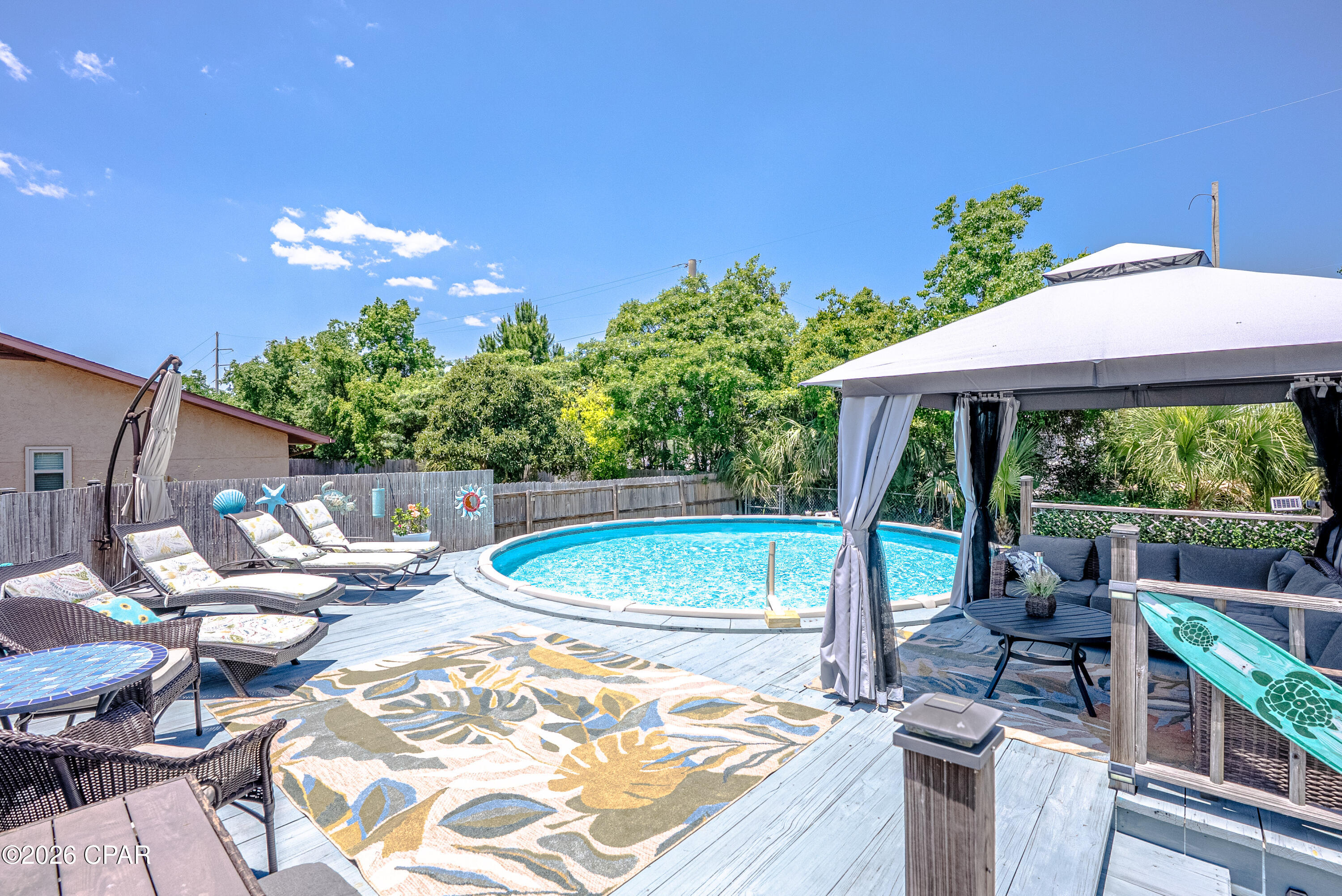 Just minutes from the beach, this beautifully maintained home offers the perfect blend of coastal charm and investment potential. Enjoy a beautiful private pool with a large deck and plenty of seating, perfect for relaxing after a day at the beach, all with no HOA and short-term rentals allowed.
Inside, you'll find gorgeous upgrades throughout, including brand-new built-in cabinetry featuring a custom TV entertainment wall and stylish coffee bar. The newly enclosed bonus room adds incredible flexibility and could easily serve as a home office, guest space, or additional sleeping area.

This thoughtfully designed 1-bedroom, 1.5-bath home features a bright and open layout with plenty of room to relax and entertain. Furniture is negotiable, making this an easy turnkey opportunity for a primary residence, vacation getaway, or income-producing rental.

Step outside to a grill area and backyard storage shed perfect for beach gear, bikes, outdoor equipment, or rental supplies. With its location, upgrades, and rental-friendly setup, this property has the potential to be a fantastic and profitable short-term rental investment.