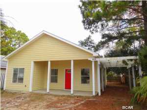 Let's go to the beach! Pride in ownership really shows in this home. This charming 3 bedroom 2 bath beach home is within half a mile from the world's most beautiful, serene sandy white beaches. This home is in a prime location near some of the best shops, schools, and entertainment. If you are looking for a cozy home with an impressively open floor plan, then look no further! Take a few steps in and you'll experience for yourself how open and spacious this home truly is. The great room has high ceilings and nice tile floors throughout. The living areas have several windows, allowing plenty of that natural Florida sunshine to permeate throughout the home. Adjacent to the great room is a large kitchen with a convenient breakfast bar. The three bedrooms are decent sized and have brand