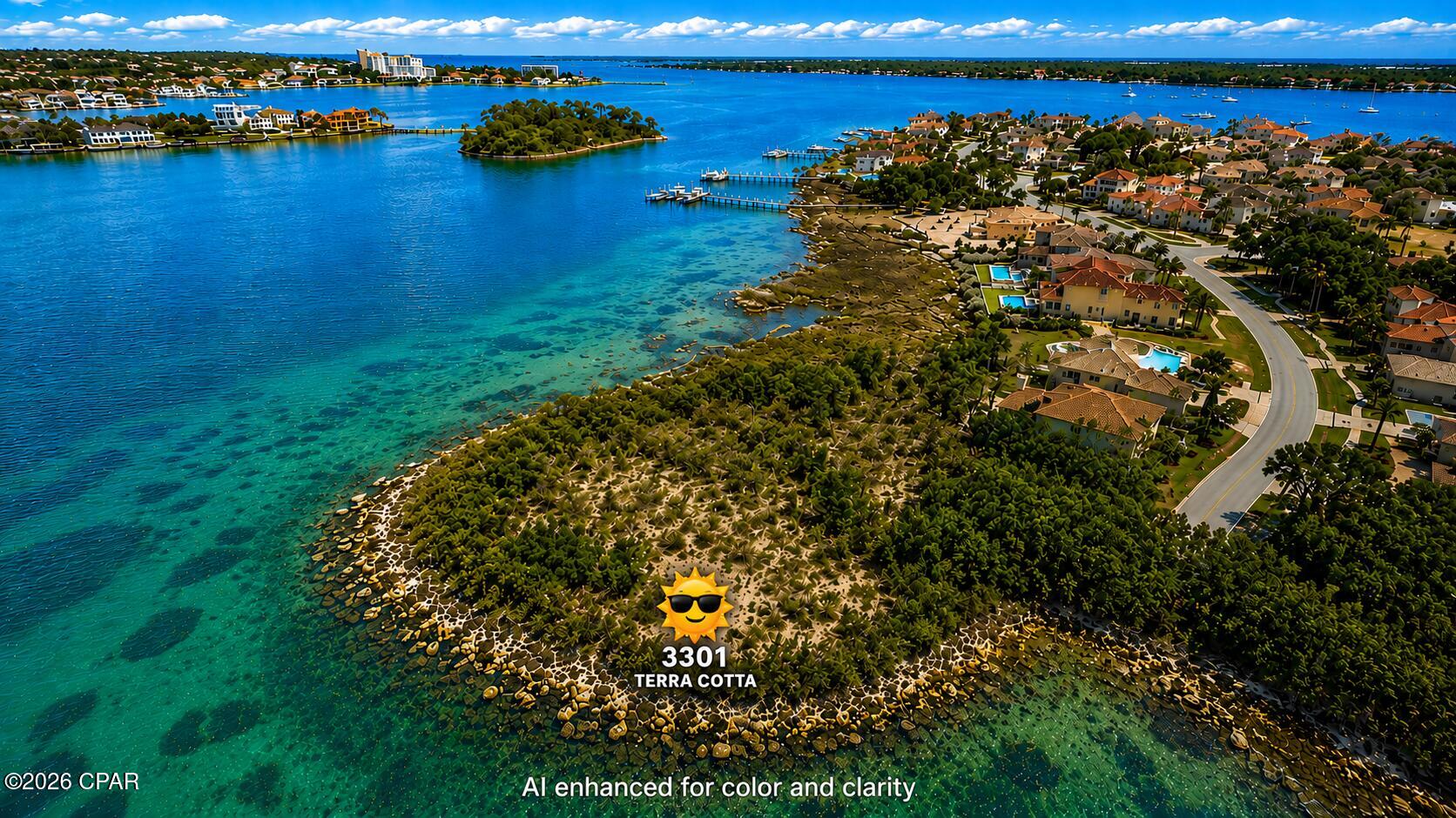 Welcome to an extraordinary opportunity inside the prestigious gated waterfront community of Finnisterre -- one of Bay County's most exclusive luxury neighborhoods. Situated along the sparkling waters of St. Andrews Bay, this rare waterfront homesite at 3301 Terra Cotta offers a breathtaking setting to build a true coastal masterpiece.

Surrounded by elegant custom homes, lush tropical landscaping, and winding private streets, Finnisterre is renowned for its upscale atmosphere, stunning architecture, and unmatched waterfront lifestyle. Residents enjoy beautifully maintained common areas, a private and peaceful setting, and a sense of luxury that is immediately felt the moment you enter the neighborhood.

This exceptional lot features expansive water views and a unique peninsula-style setting that creates an incredible sense of privacy and exclusivity. Boaters will appreciate the prime location just minutes from the Pass, providing quick and convenient access from St. Andrews Bay directly to the Gulf of America for world-class fishing, boating, waterfront dining, and endless days on the water.

Whether you envision a luxury coastal estate with panoramic bay views, a private retreat surrounded by nature, or the ultimate entertaining property, these homesites offer a rare combination of beauty, location, and lifestyle that is becoming increasingly difficult to find along the Emerald Coast.

Enjoy the perfect blend of tranquility and convenience while remaining close to premier marinas, golf courses, shopping, dining, and the white sand beaches that make Northwest Florida famous.

Luxury waterfront opportunities like this in Finnisterre are exceptionally rare.

(Measurements and other pertinent information should be verified by buyer if deemed important.)
(Listing photos AI enhanced for color and clarity)