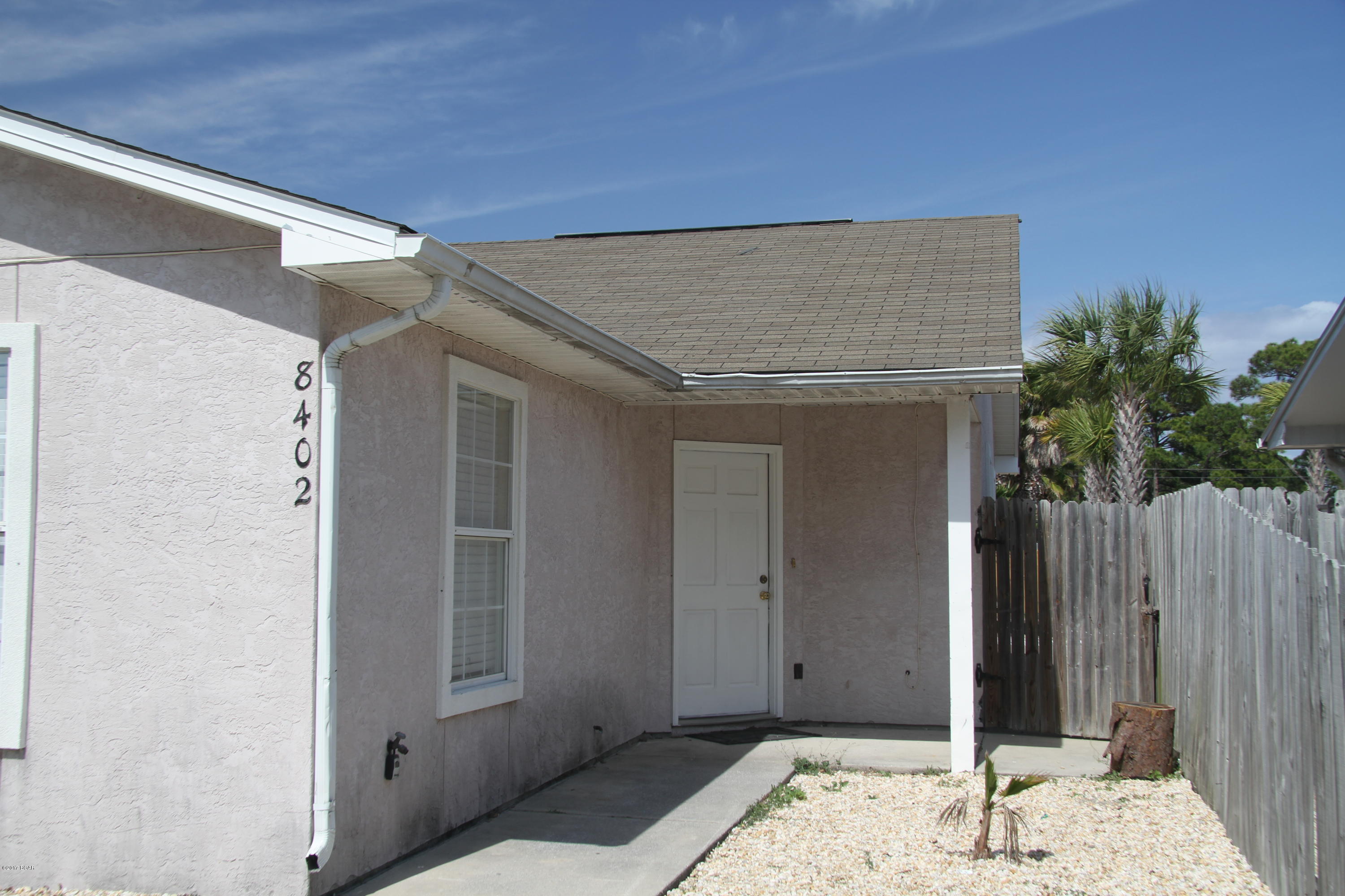 CLOSE to the beach! Great Location! This very clean and newly remodeled two bedroom, two bath, half duplex is ready to rent and did I tell you - you can walk to the beach! Brand new kitchen, granite, and stainless appliances. Bathrooms have also been remodeled with new vanities. The living area and both bedrooms are tiled. EASY to keep clean and tidy from the beach sand! Outdoor shower available, plus washer and dryer hookups. All windows come with blinds. Security deposit is required upon application approval. All prospective tenants over the age of 18 must complete an application. Background check, credit approval  and income verification is required. There is a $35 online application fee for each adult. Owner is an active licensed real estate agent in FL.