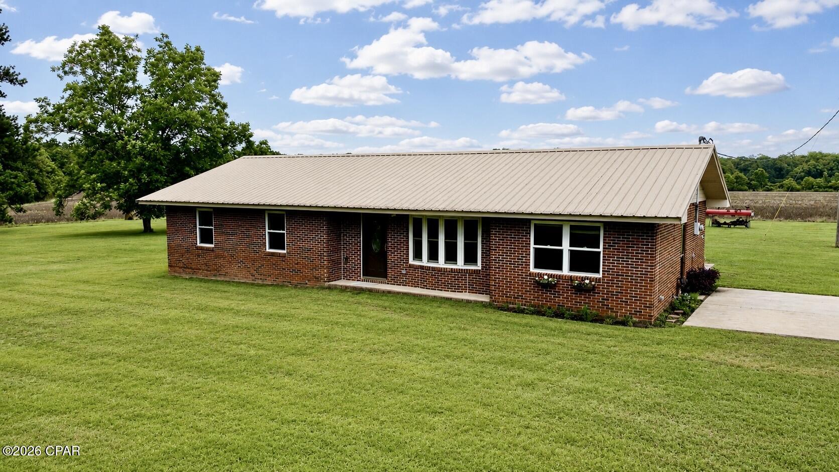 Beautifully remodeled 3BR/2BA brick home on 6+ wooded acres, offering the perfect blend of peaceful country living and convenience. Enjoy the privacy, space, and freedom of rural living while being just 10 minutes from Bonifay and I-10. Whether you're looking for a place to start a mini-farm, enjoy outdoor activities, or simply escape the hustle and bustle, this property provides plenty of room to make it your own.

Recent updates include a renovated primary bathroom, newer kitchen cabinets, bar counter, and a newer metal roof. Inside you'll find a spacious living room, additional den, and comfortable living spaces throughout. The property also features a large outdoor shed and acreage with potential for future homesites or investment opportunities.

Conveniently located less than an hour from Panama City Beach and near the growing Highway 79 corridor, this property offers both a relaxing lifestyle and future potential.

Contact your agent today to schedule a showing. Buyer and buyer's agent to verify all information deemed important to the purchase.
