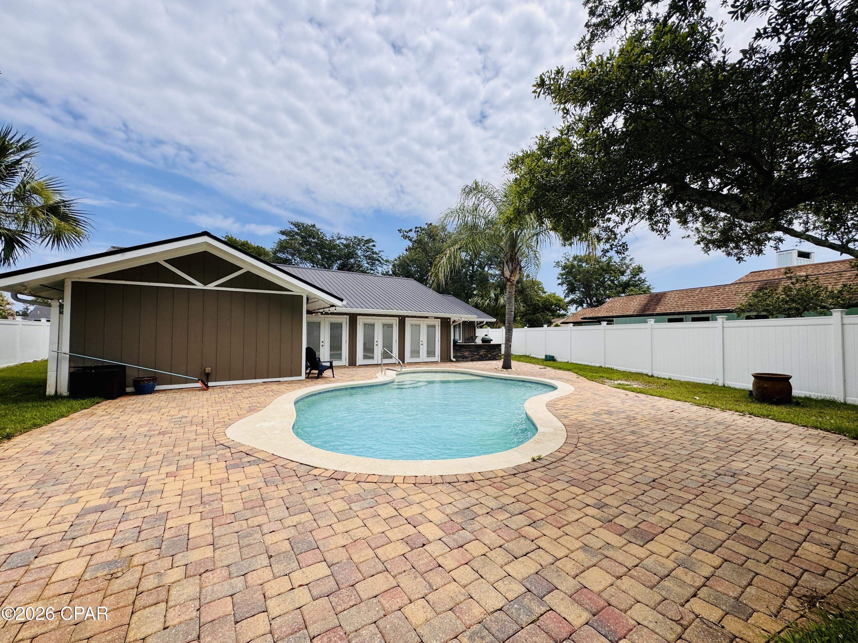 Welcome to this beautifully renovated 3-bedroom, 3-bathroom home located in the prestigious Bay Point community. Offering over 2,600 square feet of living space, this exceptional property combines luxury, privacy, and resort-style outdoor living.

The interior features a spacious open floor plan, abundant natural light, updated flooring, a beautifully remodeled kitchen, and upgraded bathrooms throughout. Designed for both comfort and entertaining, the home offers generous living spaces and modern finishes.

Step outside to your own private backyard retreat featuring a sparkling private pool, outdoor cooking and grilling area, firepit, and expansive patio space perfect for entertaining guests or enjoying peaceful Florida evenings.

Pool service is provided by the owner, allowing you to enjoy the pool without the hassle of maintenance.

Conveniently located just minutes from beaches, marinas, golf courses, shopping, dining, and Naval Support Activity Panama City, this home offers the perfect combination of luxury living and everyday convenience.