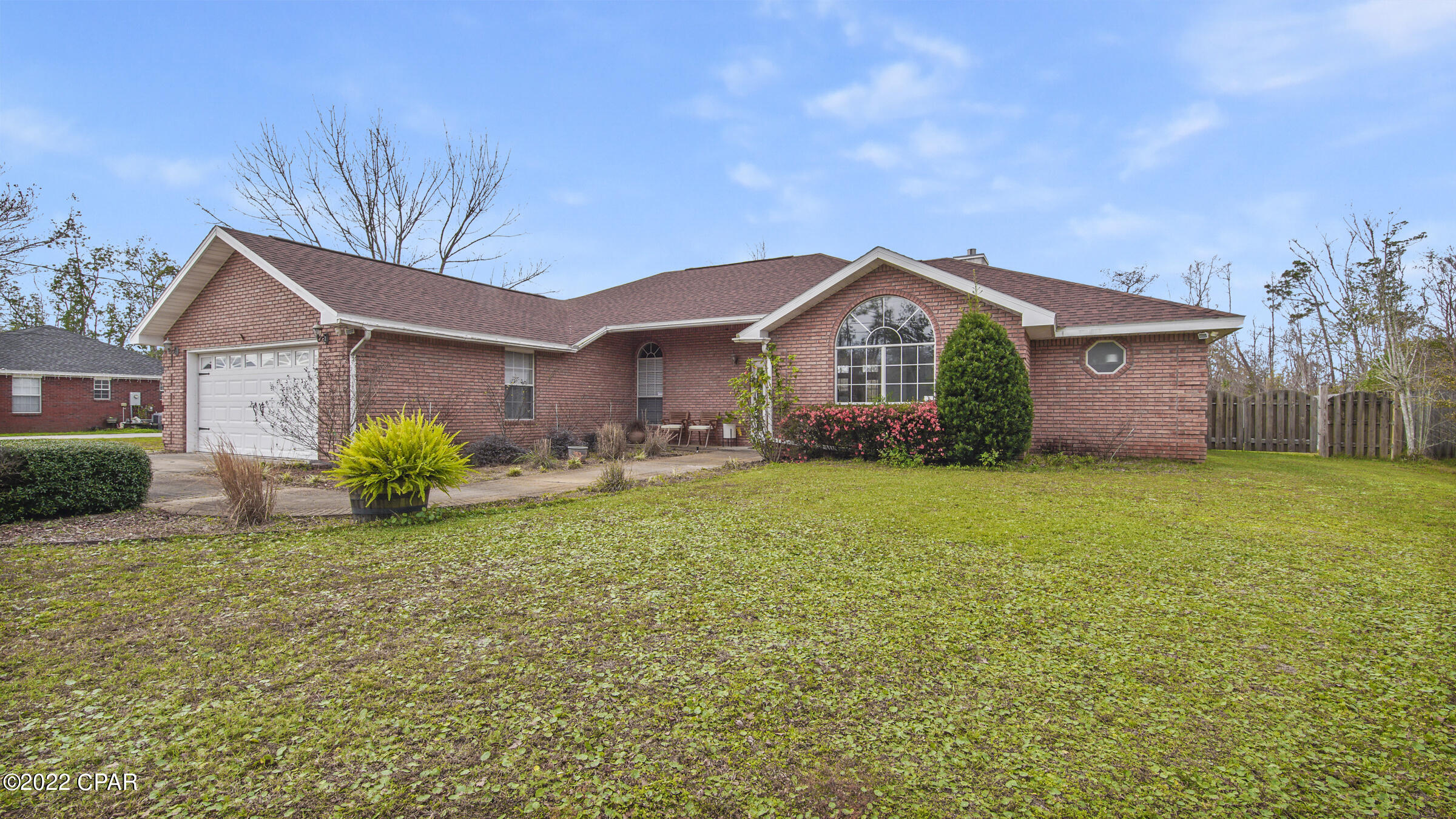 Beautiful 3 bedroom, 2 bath brick home close to Tyndall AFB on .75 acre!!! This home features an open, split bedroom floorplan with large covered back porch, gas fireplace, vinyl plank flooring in living room and master bedroom. The kitchen offers oak washed cabinets and corian counters with matching stainless appliances including a side by side refrigerator w/bottom freezer drawer, gas stove and breakfast bar. The master bedroom has trey ceiling, LVP flooring, and walk-in closet. The master bath features double vanity, corner tub and separate shower. Attached 2 car garage. The detached garage will not be usable by tenants.