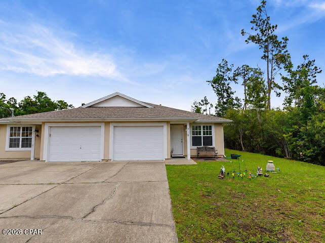 Welcome to this charming, fully furnished 3-bedroom, 2-bath duplex with a garage. Ideally located in the highly desirable Lynn Haven area. This property is in a perfect location with  Lynn Haven's Rails for Trails adjoining the backyard. And best of all it is COMPLETELY FURNISHED and move-in ready. Featuring an inviting open floor plan, a spacious kitchen with a breakfast bar, pantry, and stainless steel appliances--perfect for everyday living and entertaining. Enjoy the convenience of being less than five minutes from restaurants, grocery stores, shopping, and other everyday amenities. There are no HOA fees, making this an exceptional opportunity for homeowners, investors, or those seeking a turnkey property. Don't miss your chance to own this beautifully furnished Lynn Haven gem! All measurements should be verified by buyer.