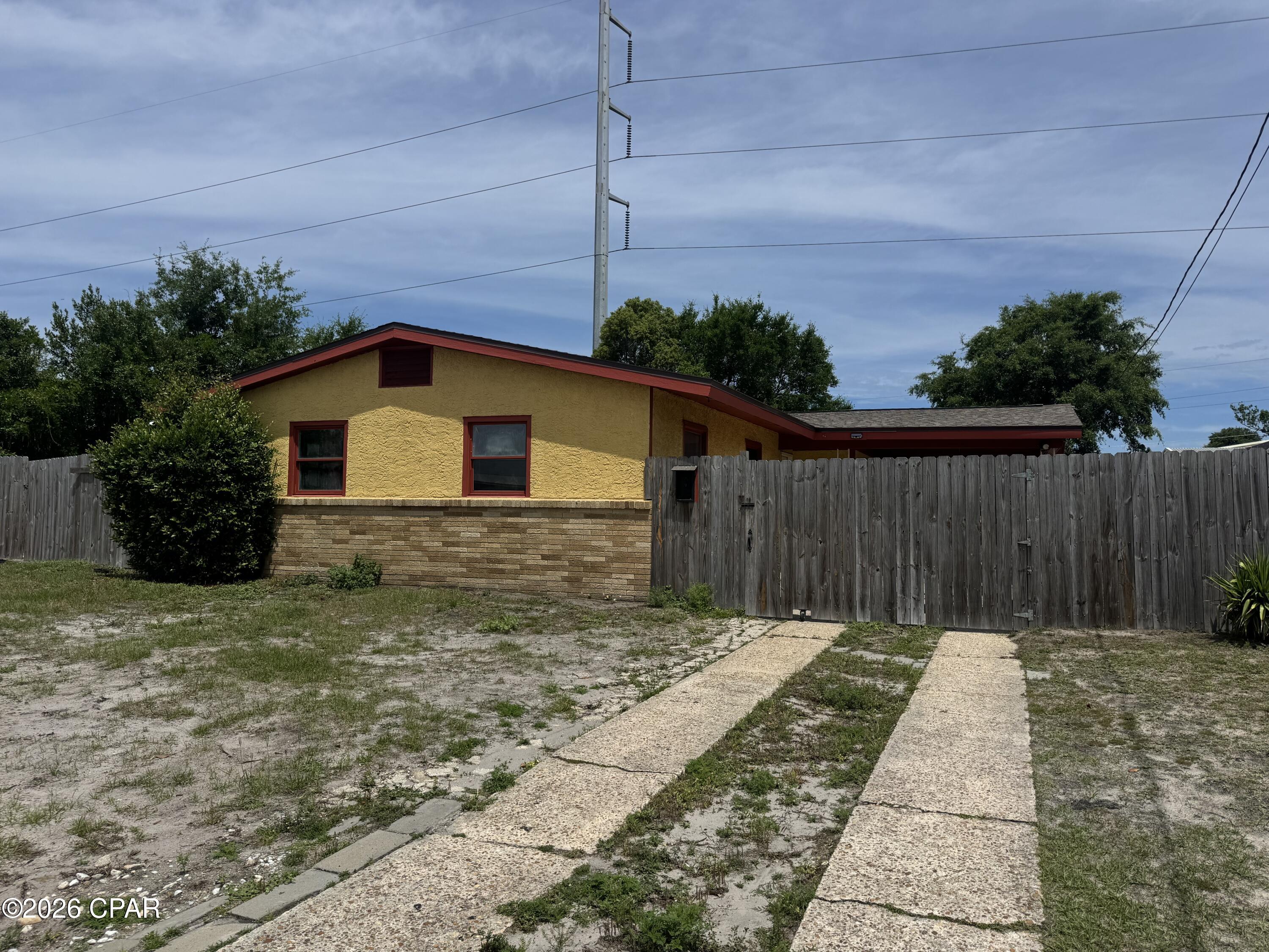 ATTENTION INVESTORS!! Conveniently located minutes from the vibrant St. Andrews area and 15 min from the beach, this home is in need of repairs and updates, but it has solid bones. Featuring 3 bedrooms, 1 bath, large eat in kitchen and nice size family room, this space is a blank canvas.  The roof was replaced after Hurricane Michael. The yard is fenced in. Outside storage/laundry room with nice carport area. This would be the perfect rental investment or resale project.
The area is great, close to everything and many houses on the street are also updating.
Come take a look and think of the possibilities! Call me today!