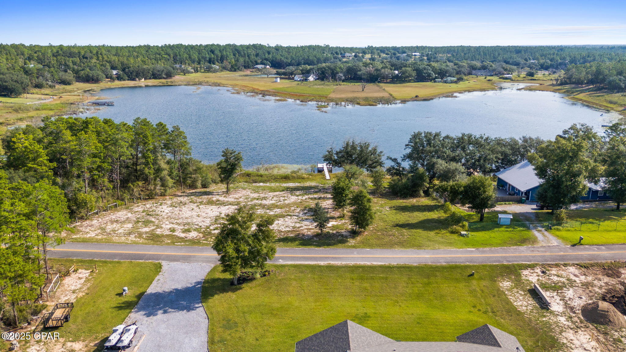 Escape to the quiet side of Florida with this 1.86-acre lakefront property located on Pine Ridge Drive in Chipley, FL. This beautiful parcel offers the perfect blend of privacy and convenience, with a well already installed and a 40-foot Trex board dock ready for fishing, kayaking, or simply enjoying peaceful sunset views over the water. 

With plenty of room to build your dream home or weekend getaway, this property provides a rare opportunity to enjoy waterfront living without HOA restrictions. Whether you're looking for a homesite, a vacation retreat, or an investment in rural tranquility, this one has endless potential.

Conveniently located just 15 minutes from downtown Chipley, 45 minutes to Panama City, and about an hour to the white sandy beaches of the Gulf Coast, you'll have easy access to shopping, dining, and entertainment while still enjoying the quiet charm of country living.

Don't miss your chance to own a slice of Florida paradise —call today!