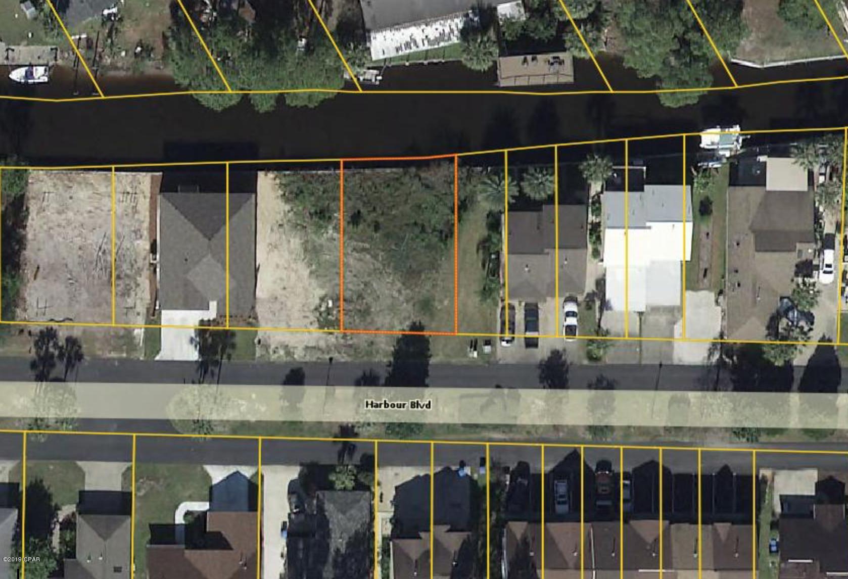 WATERFRONT! Build your custom home in a gated neighborhood with access to the bay/gulf. This section of the canal has plenty of room for a reasonably sized boat slip. Property is located just up the street from neighborhood pools and tennis courts!
