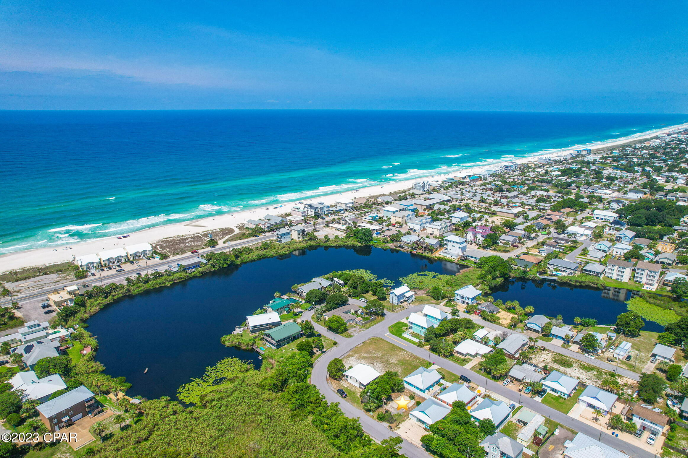 Welcome to your dream coastal getaway! This exceptional vacant lot located a mere 1,200 feet from the pristine white sands and sparkling emerald green waters of the Gulf of Mexico, offers an unparalleled opportunity to build your custom beachside oasis, or given the gulf coast's popularity as a tourist destination, this lot presents a fantastic investment opportunity for vacation rental income or future resale.

Convenient access to local shops, dining, and entertainment options makes daily living a breeze. Don't miss out on the chance to own a piece of paradise! 

Secure this vacant lot today and start living the coastal lifestyle you've always dreamed possible. Act fast; opportunities like this are rare!
