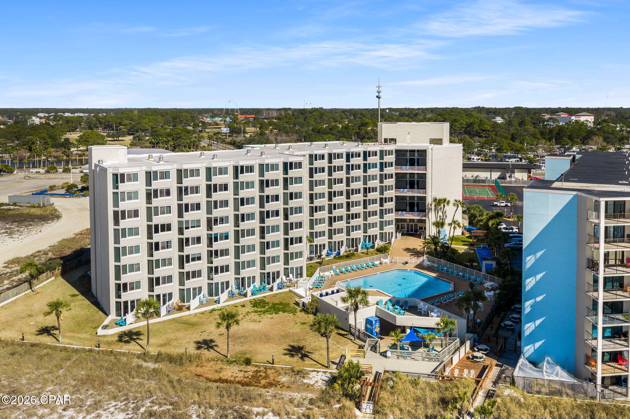 Investor-friendly beach getaway opportunity at Top of the Gulf Condominiums priced under $250K! This beautifully updated first-floor studio offers strong vacation rental appeal and an unbeatable location within walking distance to the brand new Tootsies Orchid Lounge, dining, entertainment, and beach attractions. The unit features a coastal chic design with 2 spacious beds, a fully renovated bathroom, upgraded efficiency kitchen with updated countertops, backsplash, appliances, and a spacious private patio ideal for relaxing outdoors. Additional updates include flooring, HVAC, and hot water heater in 2022. Located just steps from the pool, tiki bar, fitness center, game room, and private beach access. Top of the Gulf has also completed extensive property improvements including windows, doors, exterior epoxy flooring, and beach accessibility enhancements. Turnkey, affordable, and rental-ready.