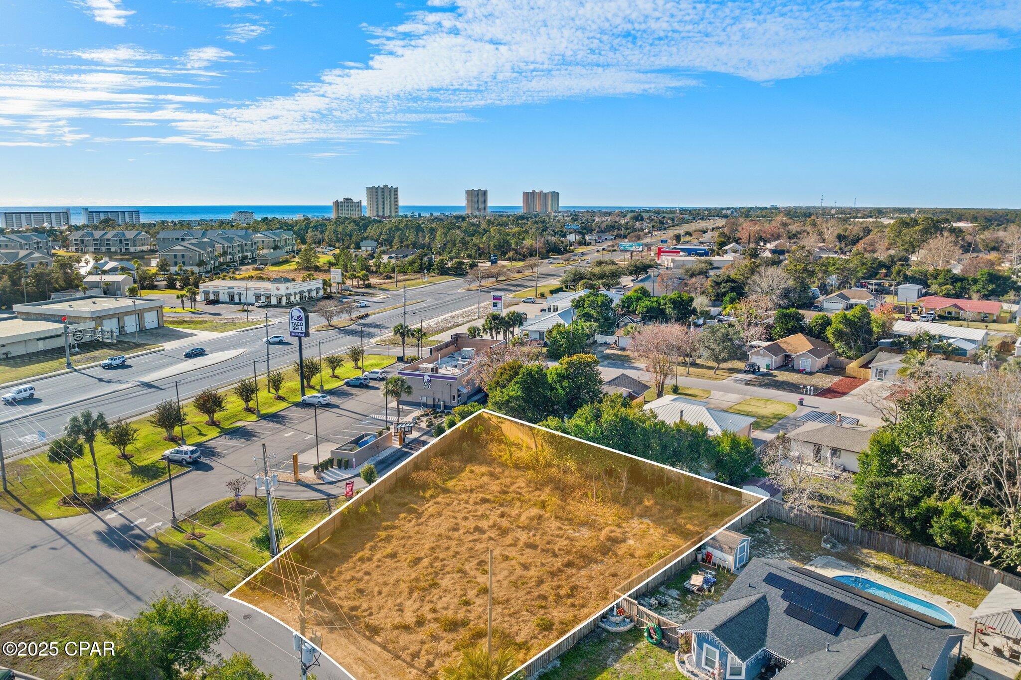NEW PRICE, AMAZING PROPERTY. Location, Location, Location. This 75' x 127' ready to build on lot is perfect for your primary residence or investment home. Prime property on the West end in an established lovely neighborhood with no HOA fees. City utilities are available and lot has been cleared and ready for your new home. Located just a few blocks from the sugar-white sands of the Gulf, this vacant lot is perfectly positioned to enjoy the very best of coastal living. You'll love the close proximity to Pier Park, Panama City Beach's premier shopping, dining, and entertainment hub--now featuring exciting attractions like the new Pirate's Voyage Dinner & Show and Topgolf. Enjoy easy access to the world-famous 30A corridor, offering charming boutiques, local eateries, art galleries,--all just a short drive away. Travel is a breeze with Northwest Florida Beaches International Airport nearby, and the area's new medical facilities provide added peace of mind. Whether you're envisioning a high-income producing short-term rental, a peaceful second home, or your full-time coastal retreat, this property delivers exceptional potential. Don't miss your chance to create the beach lifestyle you've always dreamed of--right in the heart of everything!
