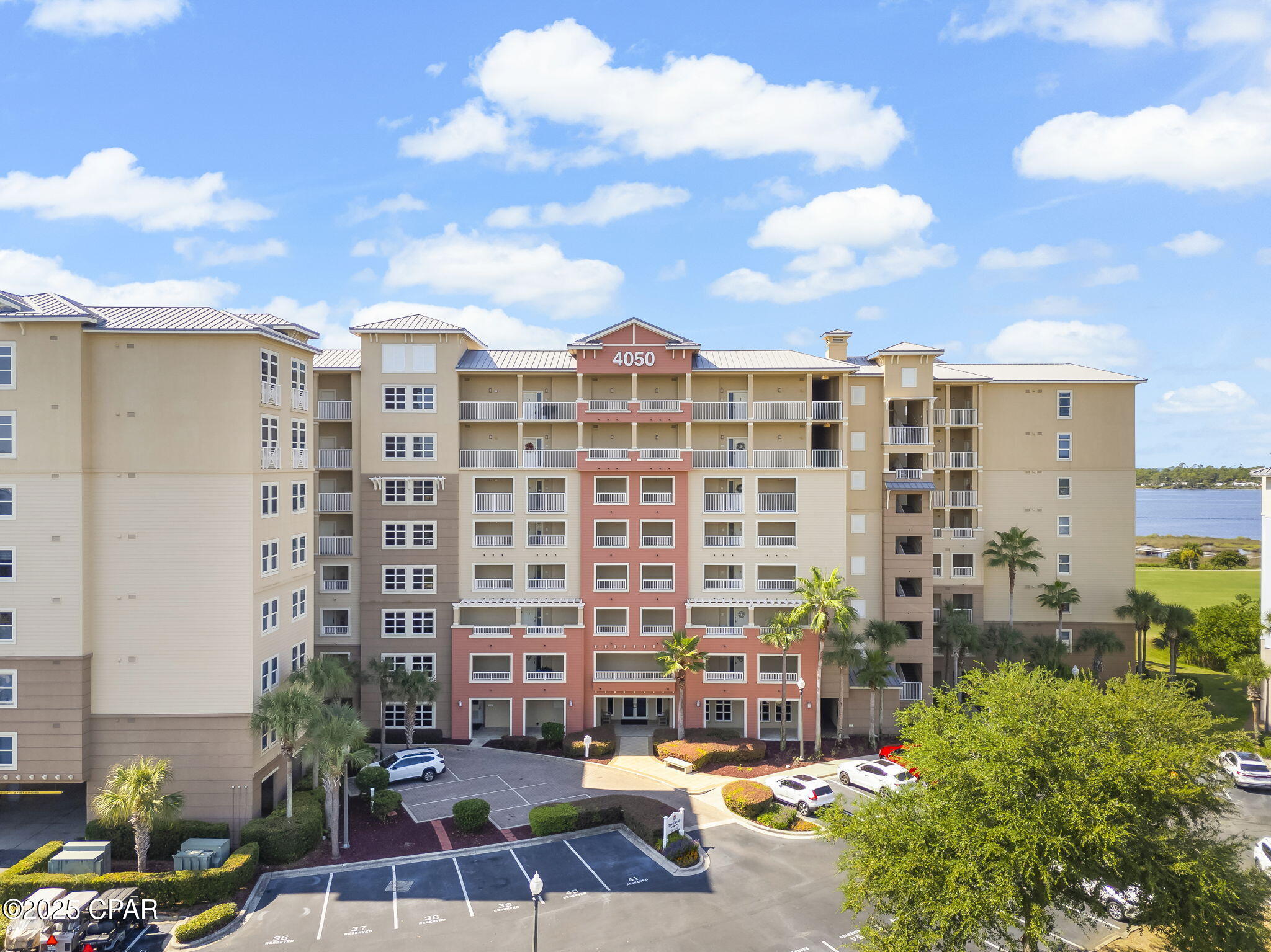 Spacious 3BR/3BA condo in the desirable Grand Residences at Bay Point with stunning views of Grand Lagoon and St. Andrews Bay. This third-floor unit offers over 2,000 sq. ft. of living space and is being sold fully furnished. Features include ceramic tile flooring, granite countertops, stainless steel kitchen appliances, and a large master suite with walk-in closet, double vanity, garden tub, and separate shower. Each guest bedroom has its own private bath. Additional conveniences include an assigned parking space and climate-controlled storage unit.  Grand Residences offers resort-style amenities including a heated pool, hot tub, fitness center, tennis courts, BBQ grills, community gathering room, and 24-hour security. Residents also have access to Bay Point's Jack Nicklaus Golf Course and Point South Marina with slips for vessels up to 120 feet.  Schedule your showing today.  All information deemed reliable but not guaranteed. Buyer to verify all measurements and details.