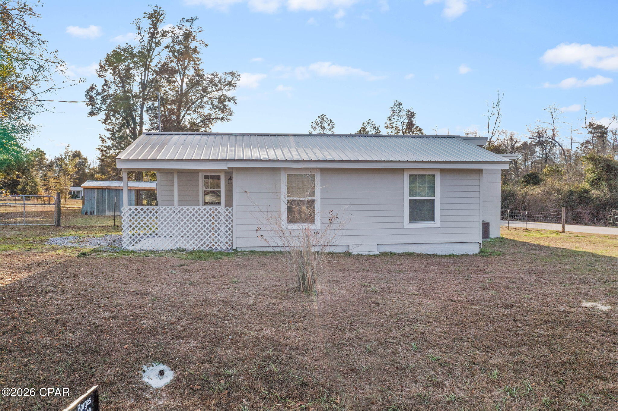 Welcome to 4895 Old Spanish Trail where you will find a completely renovated 3 Bedroom 1 Bath home with 1332 sq ft located on a corner lot with 1.14 acres! Located outside the city limits of Marianna but with all the convenances right at your fingertips. Just an easy 5 minute drive to shopping, restaurants and I-10. This home was remodeled within the past 5 years with a new metal roof, upgraded windows, plumping, electrical, HVAC water heater and appliances. The bathroom has been updated with new vanity, toilet and tile. There is a large laundry room with plenty of storage space. The kitchen has a breakfast bar wand plenty of cabinet space for everything! The open floorplan to the dining room , gives you ample space, perfect for entertaining. The bedrooms have new barn doors, new flooring thru out the home with No carpeting in the home. Perfect for those with allergies! There is a cute front porch to watch the car pass by and a large deck in the back. The yard is partially fenced, giving the kids and/or pets the freedom to play safely. There is a storage building with extra coverage to hold all your outdoor toys. This home will make the perfect place for you and your family. **POSSIBLE OWNER FINANCING WITH 25% DOWN FOR OWNER OCCUPANTS ONLY.** So call today for your personal showing.