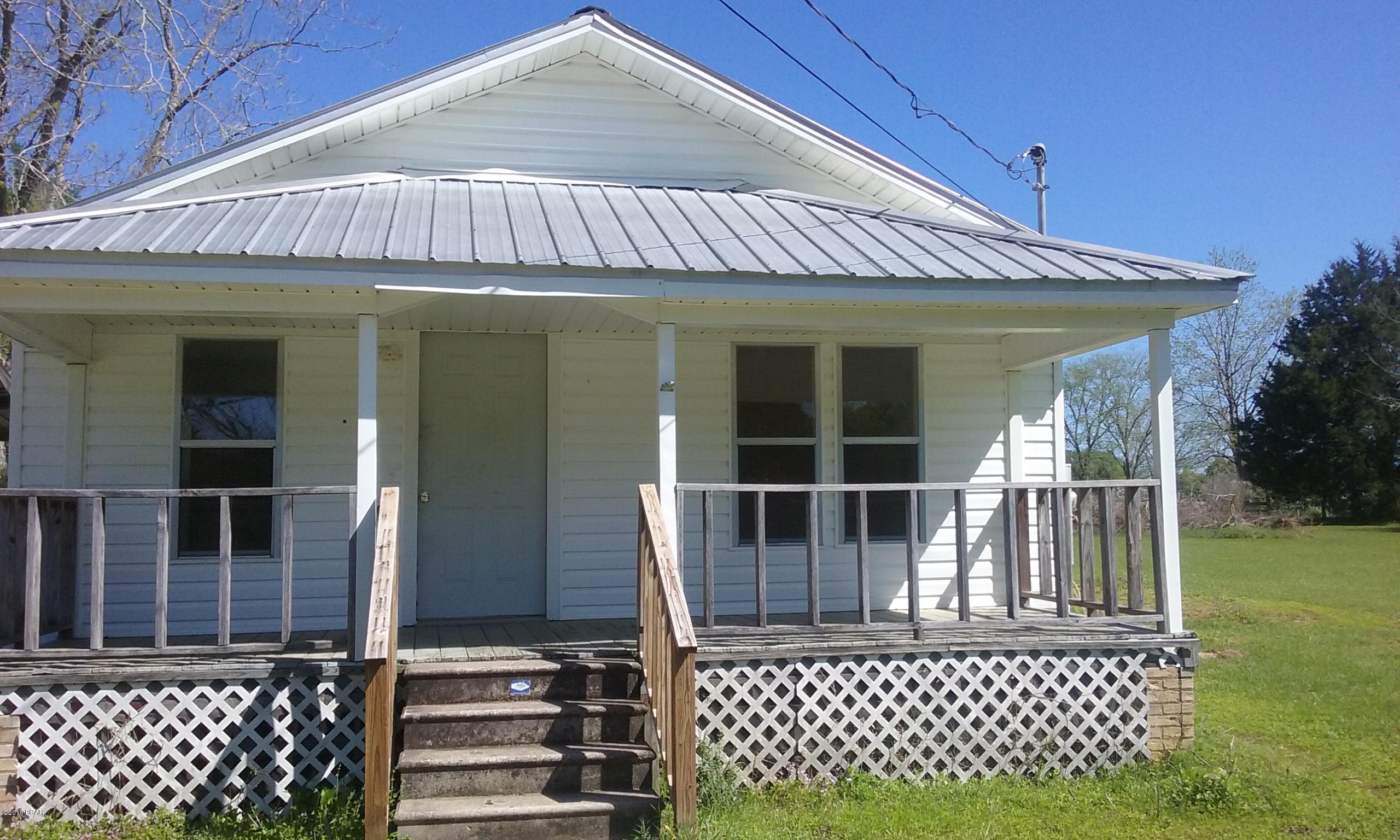 3 bedroom 2 bath home on 2 acres.  Vinyl siding. Has large storage building.