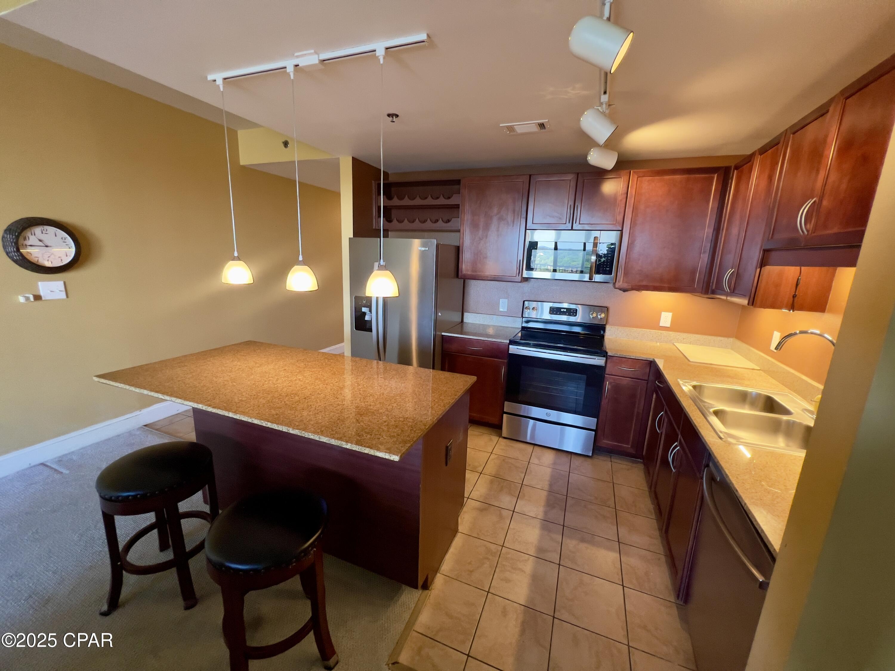 This unit is the owners personal unit and hasn't been rented since purchase. It is a lovely 2 bedroom, 2 full bath with a bonus bunk room condo. This home has stainless appliances, granite counters in kitchen and bathrooms, undermount lighting, includes all appliances and  includes the stacked washer and dryer. Your GULF (across the street) & Pool area views are incredible from the front door and Lake View and boardwalk views from the balcony. COA is reasonable and include : Insurance, Cable, Internet, Water, Garbage, Pest Control, Amenity usage and 2 car parking in the 10 story garage with parking passes. Enjoy 5 pools, boardwalk with shops and restaurants, pickleball, New 2 story gym and private coded gate access to the beach! Unit comes completely furnished.