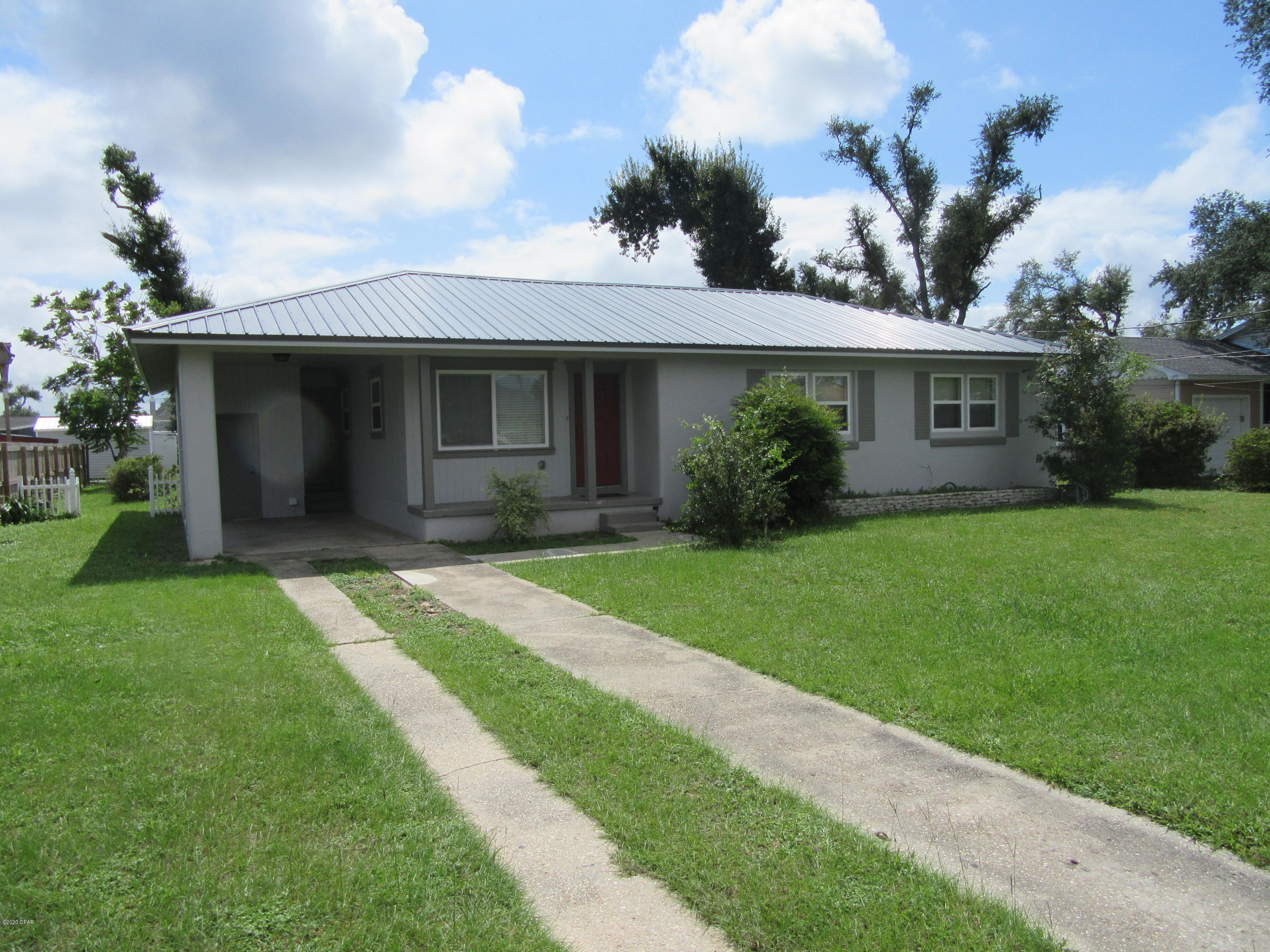 This beautiful newly upgraded 3 bedroom 1 bath home located in the much desired Cove Community has upgraded appliances, upgraded fixtures with a large lot with, electrical, plumbing, completely customized kitchen with upgraded counters, cabinets and original hard wood/carpet flooring in a large bonus room and paint throughout. Laundry room with additional work station adjacent to a covered carport. All property sizes and ages are approximate, please measure and/or verify if important. School assignments are subject to change, please check with Bay County for most accurate information. Deposit is the same as the rent. Pets allowed with owner approval and NON REFUNDABLE pet fee applies per pet. Breed restrictions apply.