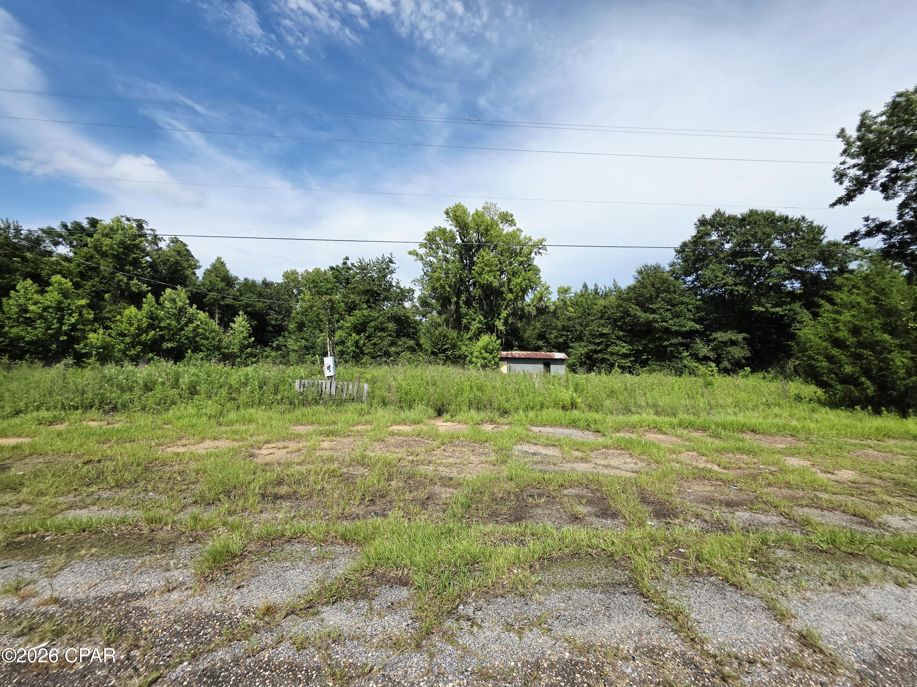 Build your dream home or invest in the future with this 3-acre vacant parcel with plenty of opportunity that offers excellent frontage on US Highway 231 in Campbellton, Florida. This undeveloped property provides easy access and outstanding visibility, making it an excellent opportunity for a custom homesite or long-term investment. Conveniently located directly across from the local fruit stand, the property is just minutes from the Alabama state line and offers a peaceful rural setting with quick access to Marianna, Dothan, and surrounding communities.
Building is on the property but does not add value. 
Multiple septic tanks on property that need to be tested. Well on property that needs to be tested. Buyer to verify all information deemed important, including build ability, zoning, setbacks, utilities, HOA requirements, and suitability for intended use.