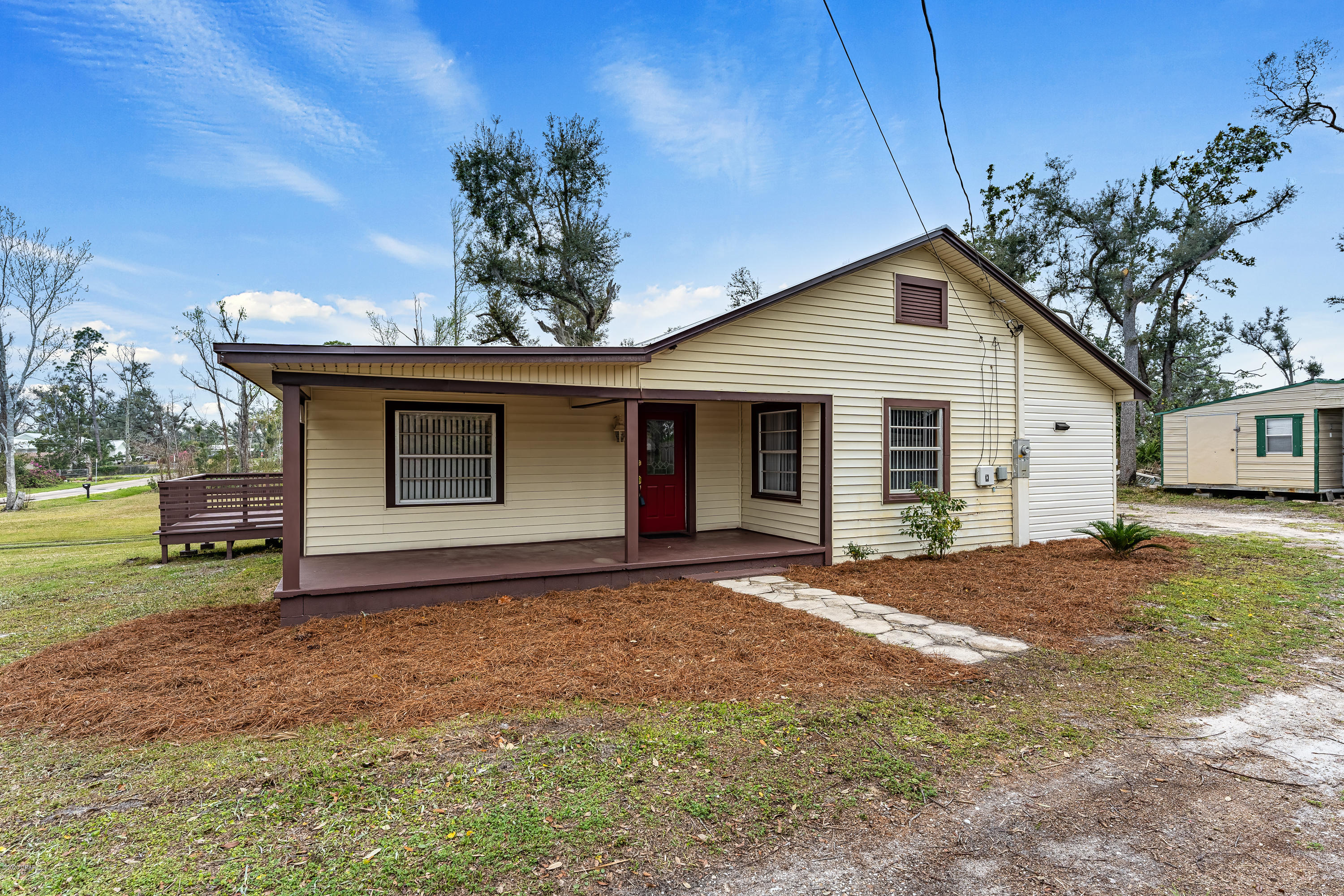CURRENTLY UNDER CONTRACT, SELLER ACCEPTING BACKUP OFFERS

Enjoy sunsets with unobstructed view of Parker Bayou from your huge 475 sg ft deck while grilling on the outdoor stainless steel kitchen. Great for entertaining or for just having a relaxing end of the day with your favorite beverage. When you are ready for the water, hitch your boat and go less than 500 feet to the public boat launch diagonally across the street. Cruise to the Gulf, catch your limit, and cruise back home.

The property consists of two contiguous lots. The other lot (a corner lot) already has septic, electric and water. You might want to sell the corner lot. Several out buildings on the property. The adjacent lot (included) is 4921 E 3rd St. Survey available.

Recent appraisal supports listing price.