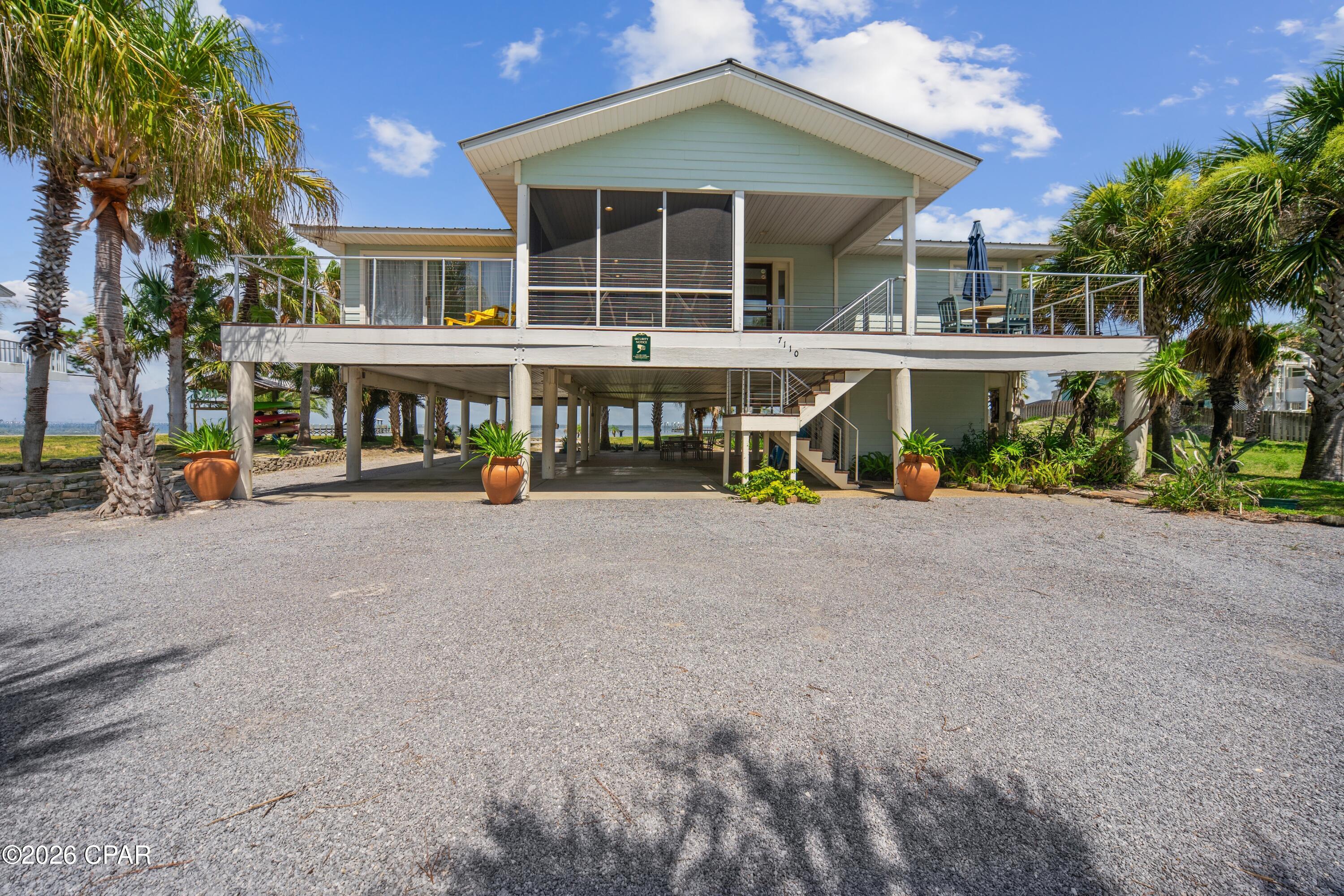 BAYFRONT SUNRISE RETREAT!! Experience the perfect blend of comfort, adventure & breathtaking natural beauty in this beautifully maintained 3-bedroom/2-bath bayfront home. Thoughtfully designed to embrace its spectacular waterfront setting, a dramatic wall of windows showcases panoramic views of St. Joseph Bay, where abundant marine life, coastal wildlife & unforgettable sunrises create a stunning backdrop for everyday living. Inside, the bright & inviting interior is designed to maximize the incredible views while offering comfortable spaces for gathering with family & friends. Whether enjoying a quiet morning coffee overlooking the water or unwinding after a day of coastal adventures, every room reflects the relaxed charm of bayfront living. Step outside & down to the waters edge to enjoy boating, paddleboarding, windsurfing, fishing, crabbing, snorkeling & endless days exploring the pristine waters of the bay. As the day winds down, gather around the fire pit to roast hot dogs & s'mores while taking in spectacular Gulf sunsets. Perfectly positioned between the bay & beach, this exceptional location offers one of the shortest walks to the Gulf, allowing you to enjoy the best of both worlds. Outdoor enthusiasts will appreciate the paved walking & biking path that spans the length of Cape San Blas, providing endless opportunities to explore the area's natural beauty. Nearby Salinas Park offers pickleball courts, horseback riding on the beach, kayak launches & bay access, while St. Joseph Peninsula State Park features scenic hiking trails, world-class birdwatching, exceptional fishing & unspoiled coastal landscapes. Whether you're searching for a primary residence, vacation getaway or investment opportunity, this remarkable bayfront retreat delivers the ultimate coastal lifestyle. Call for your private tour & LIVE THE BEACH LIFE!