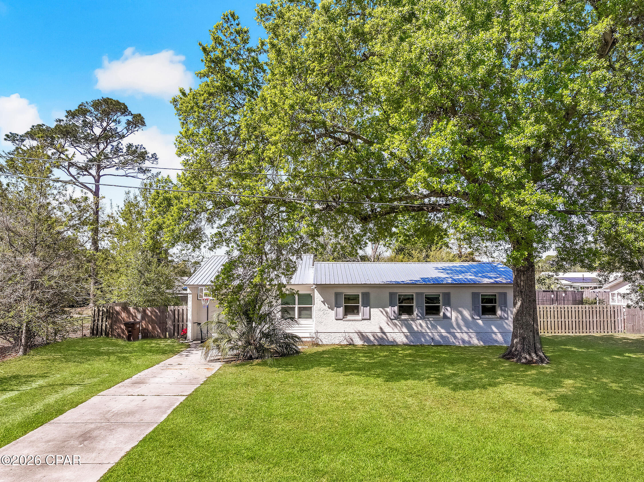 Welcome to this beautifully renovated home in the heart of lovely Port St. Joe! This charming 3-bedroom, 2-bath residence was thoughtfully updated in 2023, featuring all new flooring, modern appliances, and stylishly redesigned bathrooms--offering the perfect blend of comfort and contemporary coastal living. Step inside to find a bright and inviting layout designed for everyday living and easy entertaining. The updated kitchen flows seamlessly into the main living areas, creating a warm and welcoming space for family and guests alike. Outside, you'll love the large yard--perfect for gatherings, pets, or simply enjoying the Florida sunshine. The spacious open back porch is ideal for relaxing evenings, morning coffee, or hosting weekend get-togethers. Located just a short golf cart ride to downtown Port St. Joe, you'll have easy access to local shops, restaurants, and waterfront charm, making this home as convenient as it is inviting. Whether you're looking for a primary residence, second home, or investment opportunity, this property checks all the boxes for coastal living at its best.