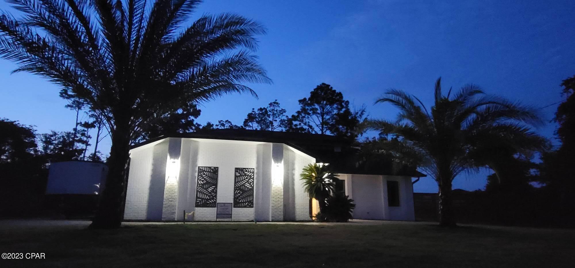 STUNNING waterfront home now for sale in Panama City, Florida! Featuring 255 feet of canal waterfront leading to St. Andrews Bay.  The home features a new fishing/boat dock & kayak dock.  The concrete pad has electric run to it for your boat house or outbuilding. This complete showstopper renovation features beautifully painted white brick on the exterior w/modern, transitional finishes throughout.  This home is a complete remodel including all the mechanical, plumbing, electrical, roof, & floors.  Designer lighting can be found throughout with unique glass pendants above the kitchen peninsula. Kitchen is complete w/new Chef Commercial Gas SS appliances, all new cabinetry, spacious pantry & quartz countertops. The laundry room is right off the kitchen and has matching quartz countertops.  Awesome Wet Bar w/wine chiller & Ice Machine. The spacious Master Bedroom includes an en-suite with a walk-in closet and designer shower system.  There are 3 additional bedrooms upstairs.  The 1st floor includes a separate space with bedroom and bathroom that could easily be a Mother-in-law's quarters, guest quarters, or separate revenue generating lodgings.  The exterior has a circle driveway an additional drive for boat or RV, a drive through oversized garage with a golf cart garage, palm trees, irrigation system, new sod, and new fencing.  This is a golf cart community!

Relax on your pool float in the inground pool, fish from your fishing dock, or simply enjoy the privacy of your new Oasis on the water!