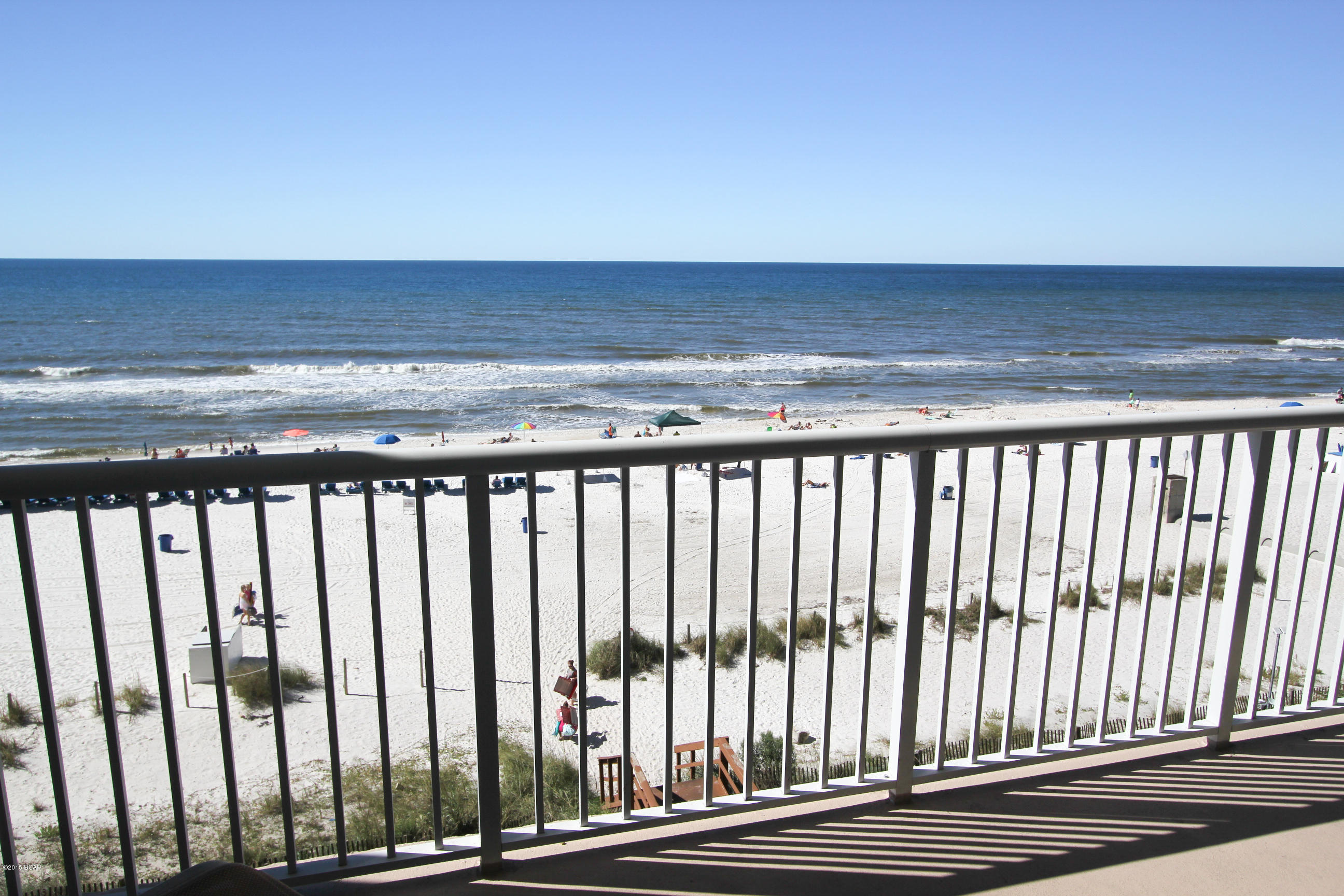 LOW FLOOR! LOW FLOOR! LOW FLOOR! Majestic Beach Towers offers breathtaking gulf and coastal views in the heart of Panama City Beach. This luxurious 3 bedroom, 2 bath condominium located on the fourth floor in Tower 1, is the beach's most popular rental floor. Lay in bed while listening to the surf and gaze into the gulf's horizon from master bedroom. The kitchen hosts stainless steel appliances, solid surface counters and ample cabinet and pantry space. Take a front row seat on the balcony overlooking the sugary sands. Watch the dolphins play as the sun melts into the Gulf of Mexico from the living room, dining room and kitchen. You can relax in the five different pools, including the large lagoon outdoor pools, the two indoor heated pools, or the kiddie pool. There are also three shared hot tubs and a fitness center with steam and sauna. If you enjoy tennis, the court is located on top of the parking garage. If you crave excitement on the water, jet ski rentals and parasailing are at your disposal. The Majestic Mart gourmet market deli and sundry shop located on the ground floor serves Starbucks coffee, breakfast sandwiches and pizzas and all your beach needs. The Grill poolside restaurant serves up the finest items to order and libations. A 125-seat movie theatre with stadium seating ensures entertaining days and evenings. Inside or out, the best Florida's Gulf Coast has to offer awaits at the Majestic Beach Towers. This condo is handicap accessible.  Age, SF Lot and room sizes are approximate. Please verify if important. Click on the photo to see!