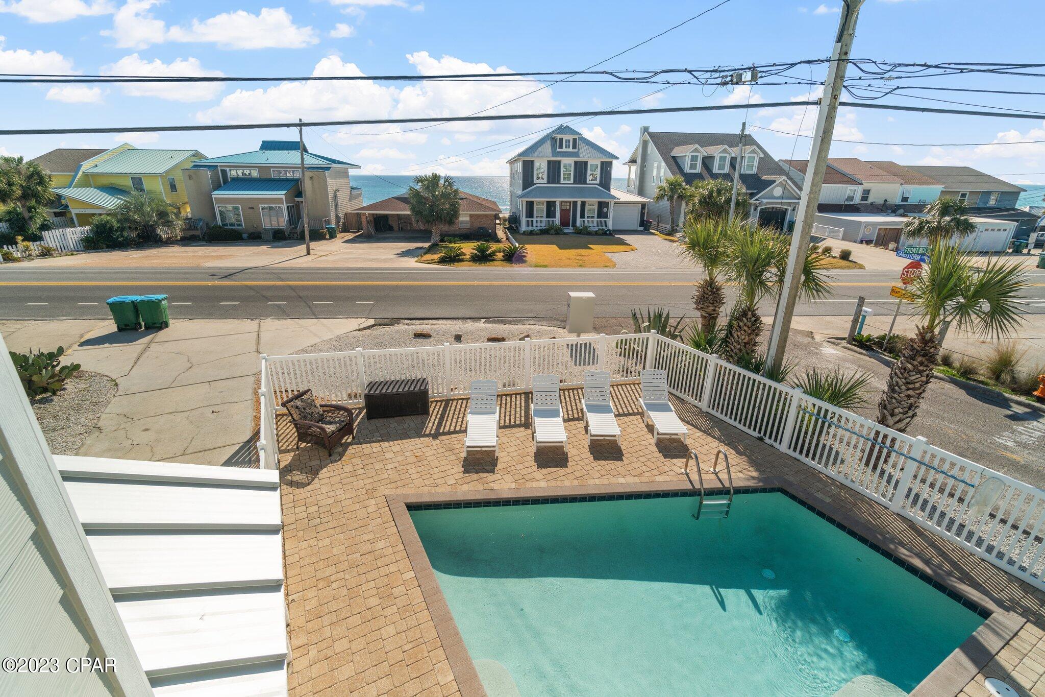 Luxury two (2) story beach home featuring four (4) bedrooms, three (3) full baths located directly across the street from the worlds most beautiful beaches on the West end of Panama City Beach. Enjoy beautiful ocean views and sunsets from the first and second floor. The property is on a corner lot and has been meticulously maintained by the Owner. This beach home is merely steps from Beach Access # 94 and the white sands of the Gulf. It has a private heated salt-water (low maintenance) pool, new metal roof, fenced in back yard and sleeps 14 with a great rental history. The home is completely furnished with many upgrades and extras such as wifi, stainless steel appliances, multiple flat screen ''smart'' TV's, beautiful granite counter tops, ceiling fans, high end flooring, new HVAC system, washer/dryer, etc. and is located approximately 3 miles from Rosemary Beach on 30A.