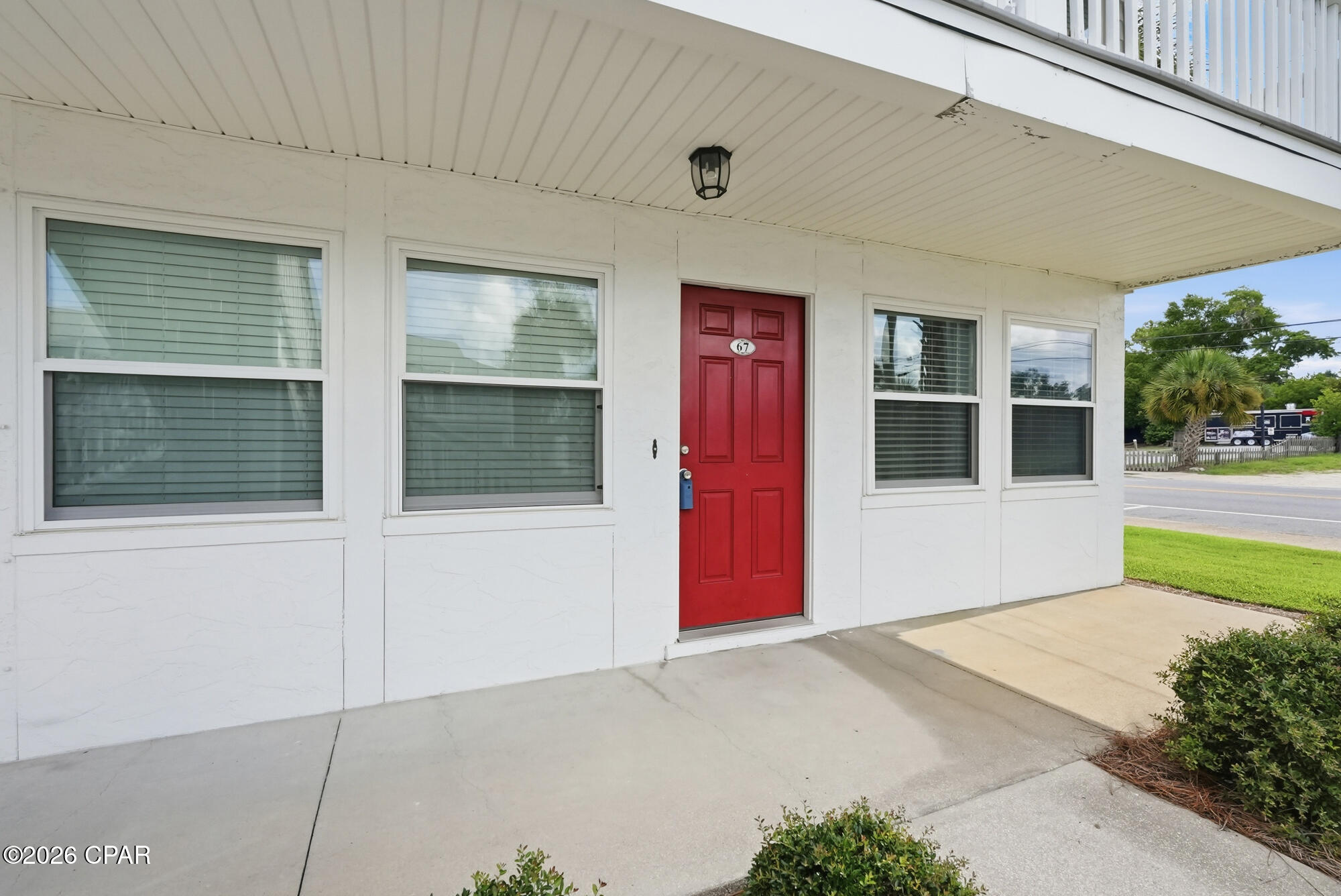 If you are looking to live in the heart of Historic St Andrews- then this is the place for you!  Saint Andrews Harbor Condominiums #67 is the perfect location to own your private residence or long term investment property, as it is centrally situated near all that downtown St. Andrews has to offer.  Located just steps from St. Andrews Bay, from restaurants, the boat dock, and not far from the marina this property offers all of the conveniences one needs for dining, entertainment, water sports, and just peaceful enjoyment.  Unit #67 is a 2 bedroom, 1 bath end unit condo that is located downstairs so steps will not be an issue.  With new marble tile flooring installed in 2025 in the bedrooms this update makes the unit look glamourous.  New modern ceiling fans installed in 2025. A new roof was installed on the building in 2019, new windows and doors thereafter, the air conditioner in the unit is a 2019, and the water heater was installed in 2018. The complex offers a community pool, a clubhouse, BBQ grills, and the HOA includes water, cable, sewer and garbage.  This quaint smaller complex makes for a relaxing, easy maintenance, quieter existence PLUS it offers all the benefits of just a short walk to all the 'beachy' type atmospheric establishments for the entertainment one seeks to have fun in the sun, to enjoy local seafood, or just to sit back and listen to some local entertainment  at one of the very popular local businesses.  Everything one needs for the Florida living lifestyle.  Come check out Saint Andrews Harbor #67, take a stroll to the water, enjoy a nice meal, and you will fall in love!  Watch the video in the photos section!