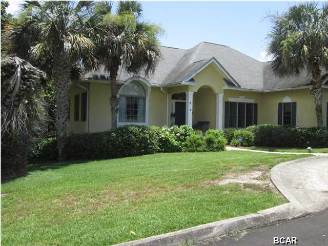 Nestled alongside Lake Powell, one of the largest coastal dune lakes in Florida, your dream home awaits you!!!! From your screened-in porch, have your breakfast or dinner while enjoying the serene view of the Lake. Your home offers unique features throughout...a formal living room, a formal dining room, dinette area off the kitchen, family room with wet bar, 2 fireplaces, View of the water from family room, formal living room, master bedroom & screen porch. 3 bedrooms downstairs, bonus/office or 4th bedroom upstairs, Master Bedroom with TWO bathrooms - one for him and one for her!!!, laundry room w/1/2 bath, trey ceilings w/ceiling lighting, a large pantry & attached 2 car garage are just a few of the features within your home. The Private Gated Community offers a community boa dock with access to Lake Powell where you can enjoy jet skiing, boating, fishing, etc. Close to Pier Park, Frank Brown Park, and 30A. Overlooking Lake Powell and just Blocks to the Gulf of Mexico.....This is truly the best of Both Worlds!!! LISTING IS ONLY FOR LOT 5, LOT 4 MAY BE PURCHASED WITH SAID PROPERTY (LOT 5) AT AN ADDITIONAL PRICE AGREED UPON BY SELLER AND BUYER.