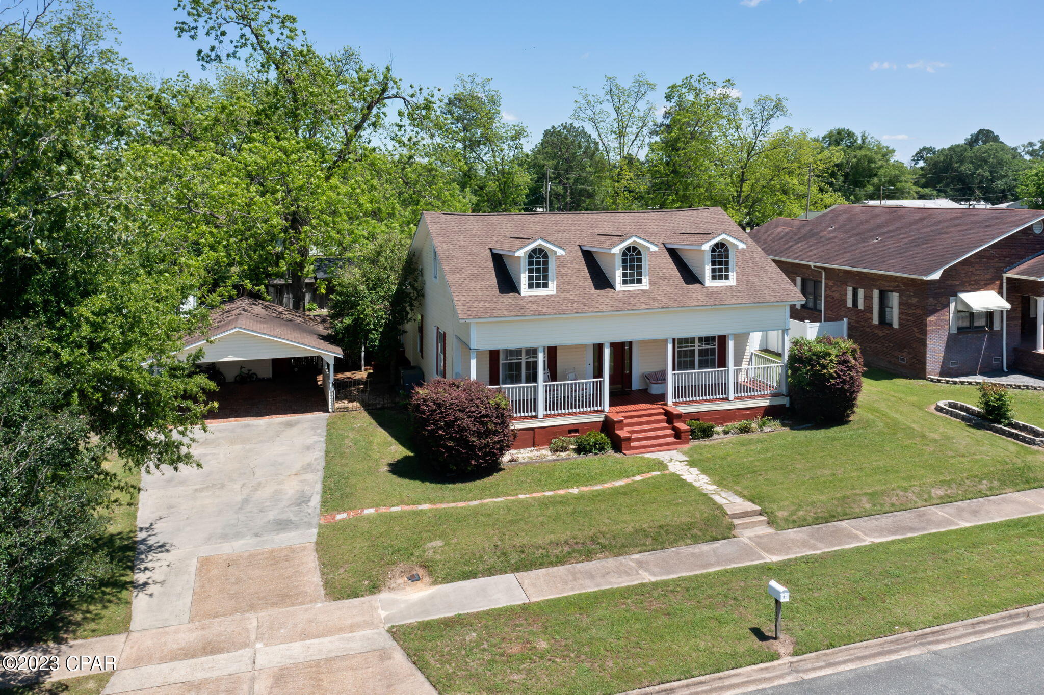 This historic southern home has been impeccably cared for and is now ready for a new family! Full of charm inside and out this 3 bedroom, 2.5 bath features over 2100 sq ft and boasts 12ft ceilings, detailed crown molding, formal living/dining room, spacious kitchen with an abundance of cabinetry and a picturesque view of the backyard. The main level also includes 2 bedrooms, 2 full baths and a family room. Upstairs boasts a 17x22 bonus room (currently used as a bedroom) and ½ bath. Outside you will find an attached carport with storage shed, covered front and back porches and fenced backyard. Property is a short drive to Dothan, Marianna and Hwy 231.