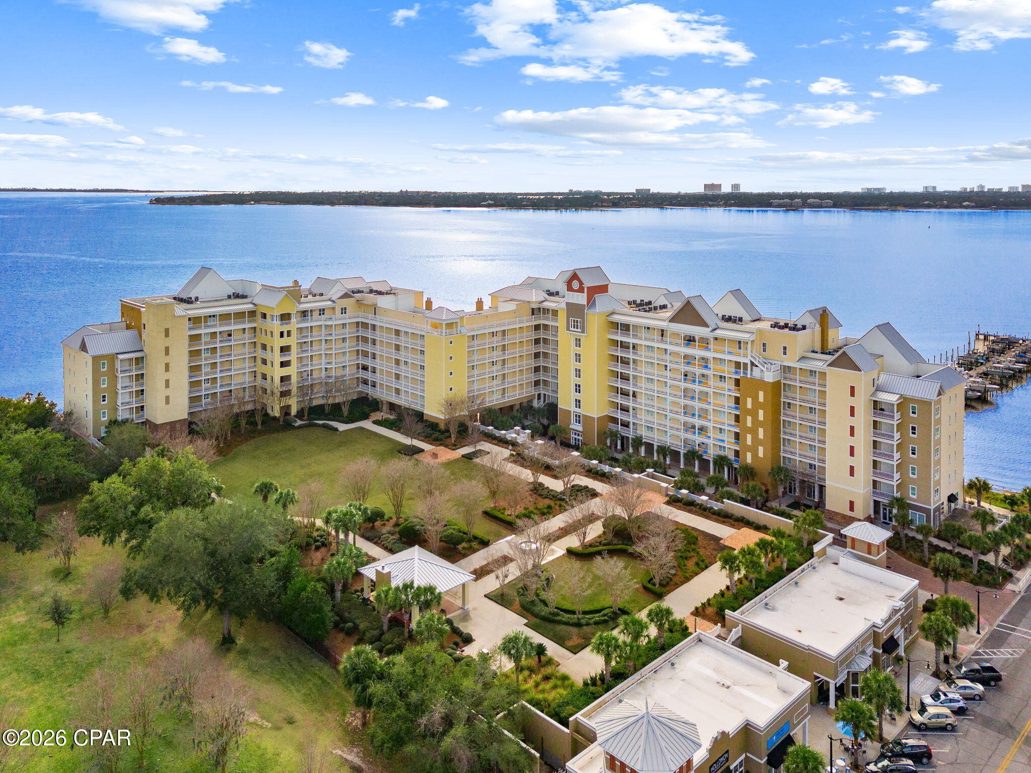 Experience waterfront living at its finest in this stunning 3-bedroom, 3-bathroom condo in Harbour Village at Historic St. Andrews. Located along the Bay, this exceptional property offers breathtaking views, creating the perfect backdrop for both relaxing and entertaining. The spacious layout provides an open, airy feel with abundant natural light and private waterfront scenery from the main living areas.  Boating enthusiasts will appreciate the12,000lbs boat lift that is included, providing convenient access to the gulf, intercoastal or Shell Island.  Also, comes with a deeded storage closet for added storage and organization.
Harbour Village offers an impressive collection of resort-style amenities, including a heated waterfront pool overlooking the Bay, a fitness center, and a grand clubhouse perfect for gatherings and community events. Residents also enjoy a private community park with green space where dogs are welcome, a covered parking garage, and inviting outdoor spaces to include a waterfront fireplace with comfortable seating and a grilling gazebo with direct access to Oaks by the Bay Park.
Located in the heart of Historic St. Andrews, this rare waterfront condo combines luxury, boating, and a vibrant coastal lifestyle just minutes from amazing local restaurants, shopping, and local attractions.