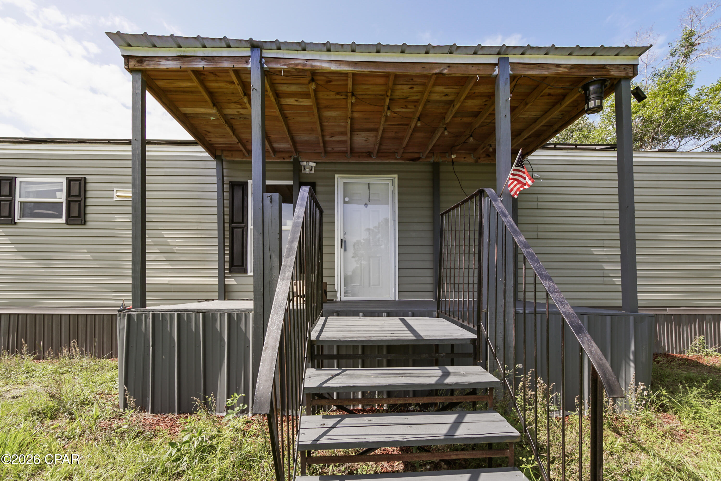 Enjoy peaceful country living, with nearly 1.5 acres offering plenty of space and privacy. This 2019 mobile home offers a desirable split-bedroom floor plan. Primary bedroom is spacious and includes a walk-in closet, large shower and double vanities in master bathroom. Living room showcases built in shelving, with an open kitchen and dining area. The deep lot features a fenced in back yard making it ideal for pets or simply relaxing around a bonfire. Adding to the home's value are fully paid-off solar panels, recently serviced and in excellent working condition, micro inverters under warranty until 2045. New hot water heater installed 1/28/2026. let this be your next home.