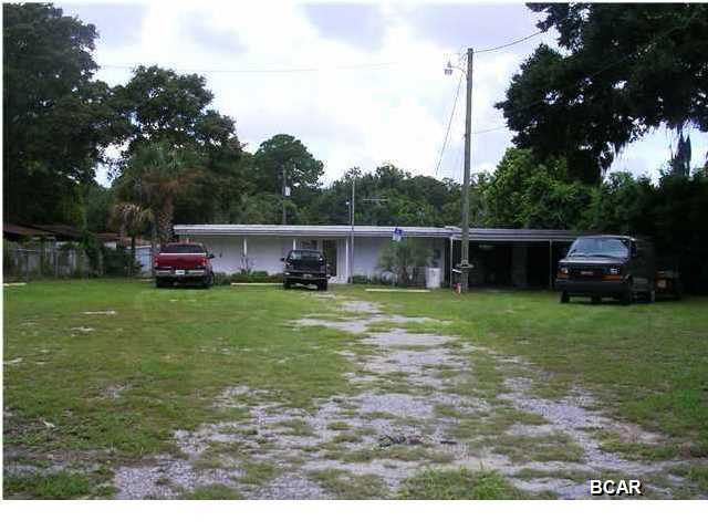Nice mixed use property fronting Chestnut Avenue with potential for a variety of uses.The main structure is an open, air conditioned workshop with power throughout the space. Plus in the middle of the shop carry 50 amps of power and three phase is run to the building. There is also an attached, enclosed garage. Property being conveyed is located within the fenced area.