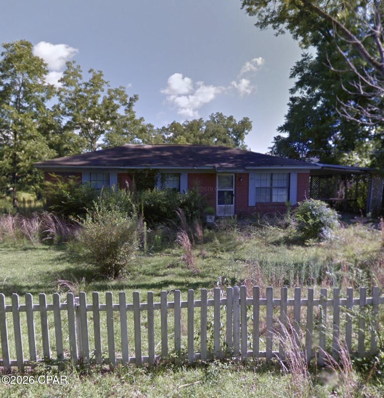 PENDING! Vacant brick home located with a large lot located in Noma, FL needing full reconstruction to be livable. City Utilities Available.