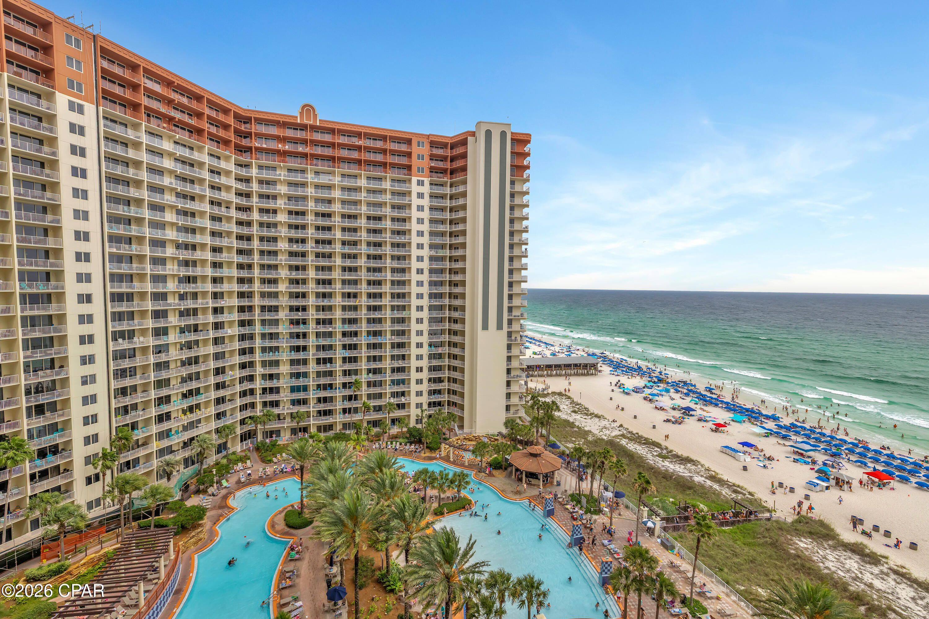 SELLER FINANCING AVAILABLE. FIFTH-FLOOR DEEDED PARKING. TWO BEDROOMS PLUS BUNK AREA WITH THREE FULL BATHROOMS.
Shores of Panama Unit 1207 in Panama City Beach, Florida offers a smart, rental-ready floor plan with the kind of practical features buyers notice quickly. This desirable ''B'' floor plan features two bedrooms, a bunk area, and three full bathrooms, giving the layout more flexibility than a typical two-bedroom condo.
One of the standout advantages of Unit 1207 is the fifth-floor deeded parking space, offering convenient access within the resort's parking structure. Owners and guests also have the option to drive up to the 12th floor to take advantage of additional parking when available, adding another layer of convenience for this higher-floor residence.
Positioned on the west side of the building, Unit 1207 features balcony views of the resort-style lagoon pool along with coastline views across Panama City Beach. The condo is being offered fully furnished and rental-ready, with a full-size front-load washer and dryer, black appliances, fresh paint, wood flooring throughout the main living areas, and tile in the kitchen and bathrooms. An owner's closet adds valuable private storage, a detail that can make a meaningful difference for personal use or rental ownership.
The owner currently self-manages the property, offering flexibility for future owners who wish to continue self-management or select their preferred rental management company.
Shores of Panama Resort features one of Panama City Beach's most recognizable gulf-front lagoon pool settings. The zero-entry tropical pool includes palm-lined islands, fountains, and a spacious hot tub set along the resort's private beachfront access. Additional amenities include an indoor heated pool and hot tub, a 24-hour fitness center, and a seasonal poolside tiki bar.
Located in the heart of Panama City Beach, Shores of Panama places dining, shopping, and entertainment nearby. Pineapple Willy's is adjacent to the resort, while Laketown Wharf directly across the street offers several dining, retail, and entertainment options, including Wharf Seafood Buffet, The Candymaker Ice Cream Shop, PCB Pizza, In Cahoots, The Press, The Bun Lab, 810 Billiards & Bowling, salon services, and more.
Panama City Beach has also welcomed several newer attractions and entertainment venues, including Dolly Parton's Pirates Voyage Dinner & Show, Topgolf, McGuire's Irish Pub, and Tootsie's Orchid Lounge.
HOA dues are $4,419.50 per quarter. All information, including HOA fees, is deemed reliable but should be verified by buyers if important.