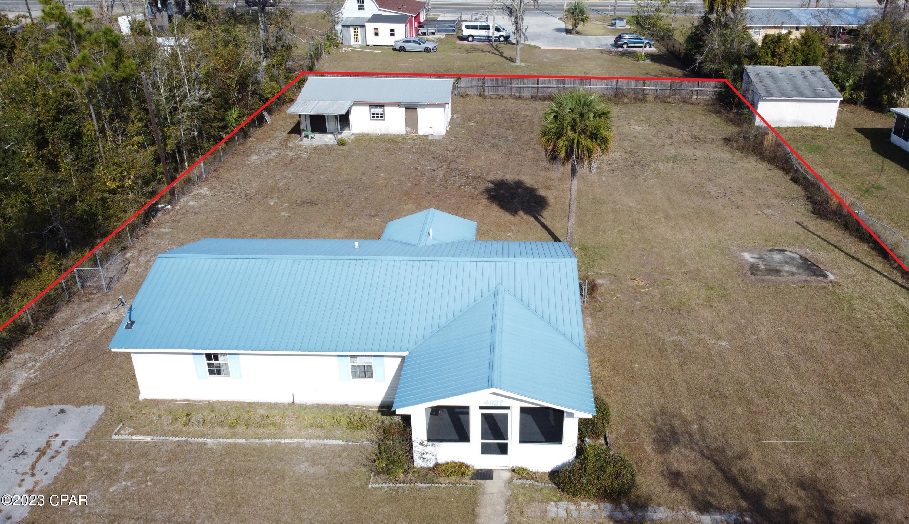 Amazing opportunity to own a home with a separate studio apartment! Spacious half acre lot. Main home is an 1152 sqft 3/1 and Studio is 680 sqft with bathroom and laundry room. Main home has a metal roof, newer hvac and nice screened-in front porch. Needs cosmetics such as new flooring and paint but other than that move-in ready. Studio has metal roof but needs flooring, drywall on the ceiling, and appliances. Live in the main house and rent the studio, or rent them both for an income producing property. Great proximity to Tyndall Air Force Base. Just a short walk to Parker Bayou. Minutes from restaurants and shopping. Priced to sell.