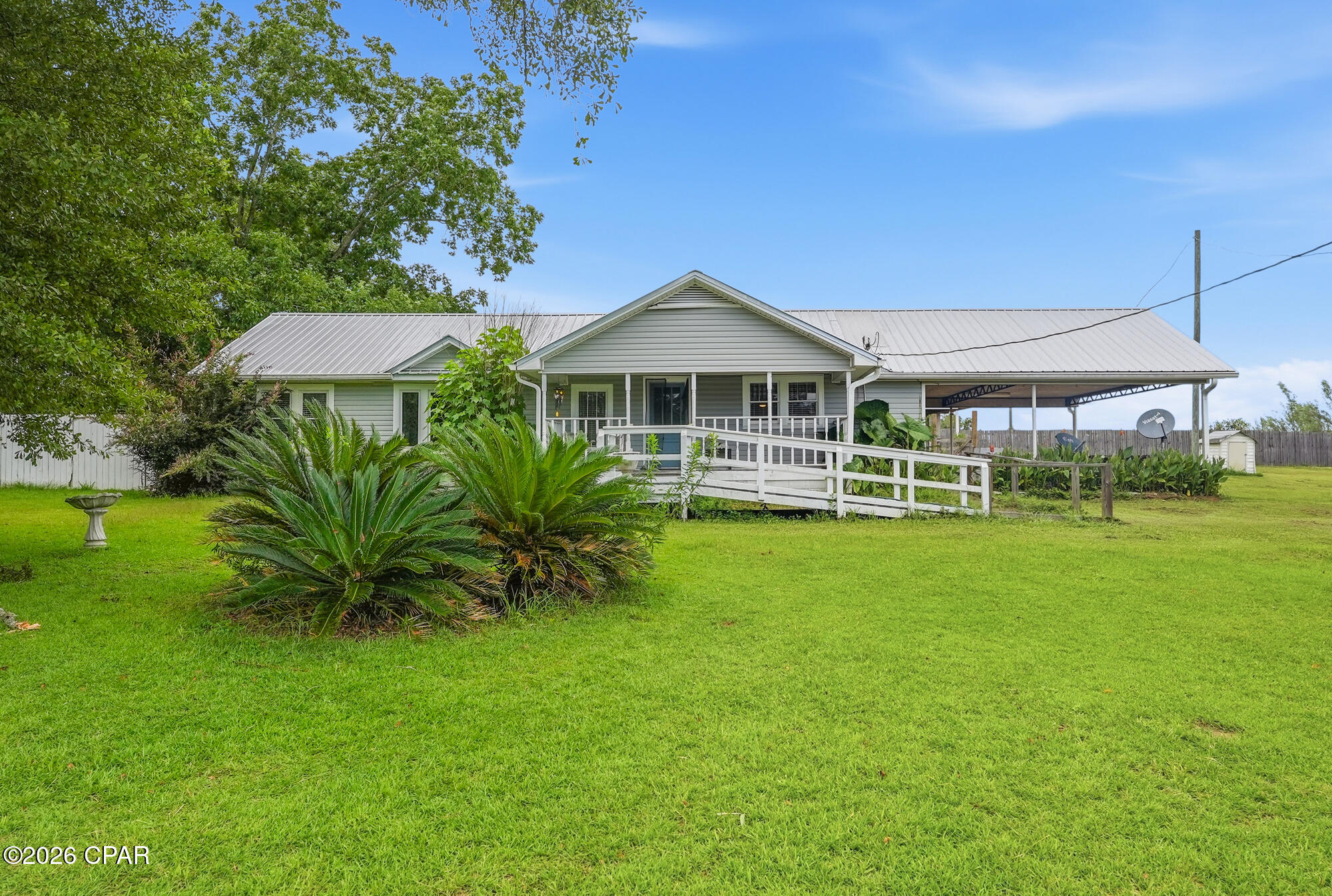 Enjoy the charm of country living with this inviting ranch-style home situated on over an acre of beautifully maintained land in the heart of Bonifay. Thoughtfully updated and meticulously cared for, this property offers modern comforts, practical spaces, and the perfect blend of character and functionality.
The main home features a warm and welcoming layout with spacious living areas, four bedrooms, and two bathrooms, providing plenty of room for family, guests, or a home office. The detached guest house, updated in 2023, includes new windows, fresh paint, a cozy living area, a small kitchen, and a full bathroom--ideal for visitors, multi-generational living, or potential rental income.
The sellers have completed numerous valuable updates, including:
Brand-new HVAC system (March 2026) featuring a new air conditioner and furnace--a significant investment and a valuable upgrade for Florida homeowners.
New flooring installed in select areas to seamlessly match the existing flooring throughout the home.
New A/C vents added to the rear of the home for improved airflow and comfort.
New electrical panel for the main house (2021) and a new electrical panel for the Morton shed (2023).
Kitchen updated with new appliances, including a brand-new dishwasher that has seen very little use, as the owners preferred hand washing dishes.
New washer and dryer ventilation system (March 2024).
Updated electrical outlets throughout the main house (2024).
New ceiling fans installed throughout for enhanced comfort and style.
For the hobbyist, craftsman, or anyone needing additional storage, the property also includes a detached workshop/garage conveniently located beside the main home, offering abundant space for projects, equipment, or recreational gear.
Step outside and enjoy over an acre of open space with plenty of room for gardening, outdoor activities, or simply relaxing. The property also features established blackberry bushes and a peach tree, allowing you to enjoy fresh fruit right from your own backyard.
Conveniently located near Bonifay's local amenities while offering the peace and privacy of country living, this beautifully maintained property is a rare opportunity. Schedule your private showing today and discover everything this exceptional property has to offer.