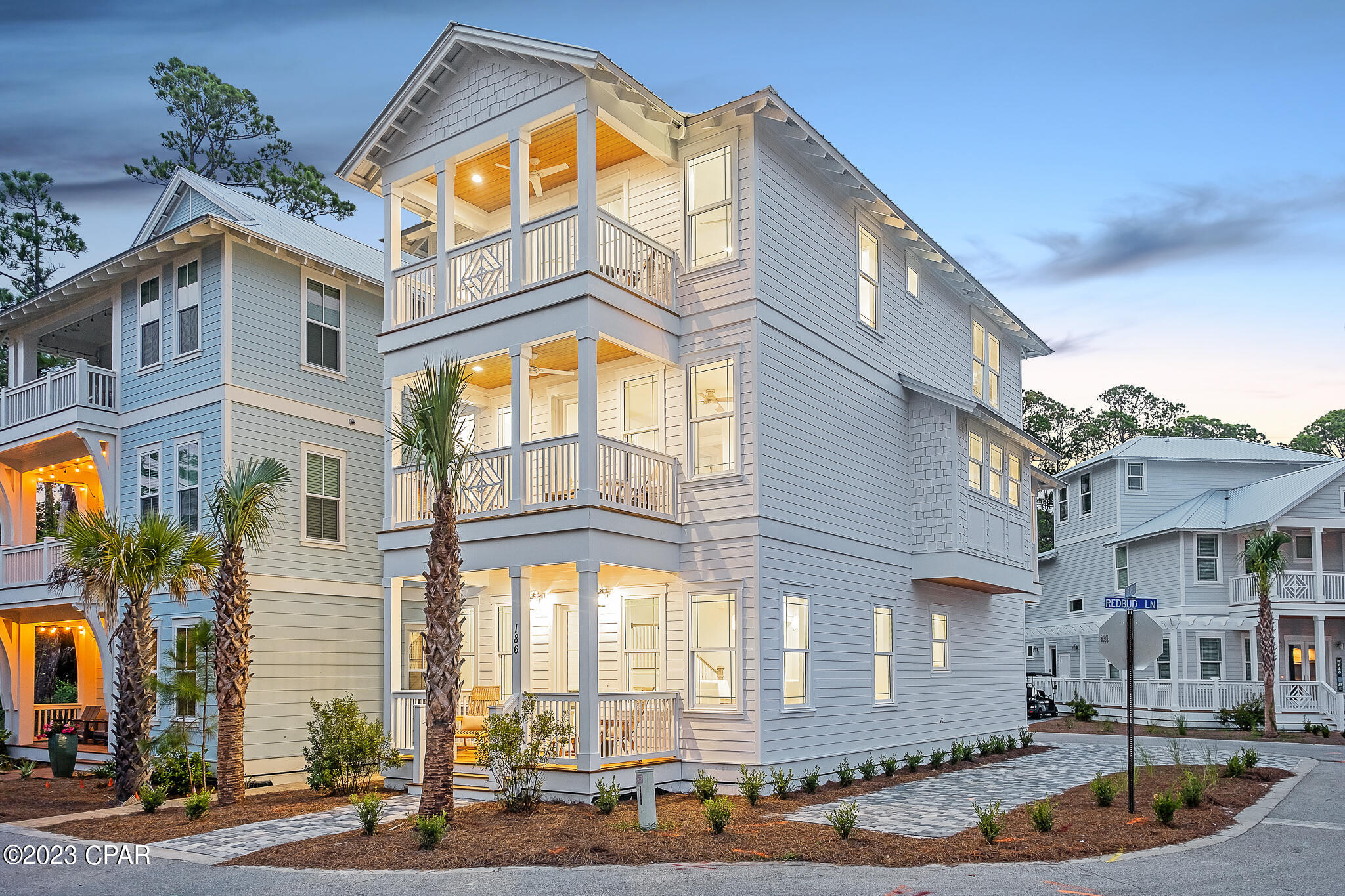 ''Five Porches'' is a completed new construction opportunity in Treetop Village on a corner lot with ample paved parking. Attractively positioned as a rental investment, primary, or secondary residence. Easily accessible and private with two gates one from 30A through Seacrest Beach and a second gate on Highway 98. Thoughtfully curated with coastal inspiration featuring five bedrooms and four and a half baths. Highlights include: an open concept with two living rooms spaces, a game room, and bunk room behind a three-story facade. Five porches provides multiple areas for entertaining inside and out including a first floor living room with a linear gas fireplace, and an additional area for gathering on the second level inside and out with a screened in porch and media wall.

Featuring high-end finishes including: shiplap, raised ceilings with crown molding, engineered hardwood floors, custom closets,
and quartzite and ceramic tile enhancing all of the baths. The master ensuite bath features veined tile and a deep stand alone tub. There is a king bed on the first level with ensuite bath and private entrance. The primary suite has complete privacy on the second level with an ensuite luxurious bath and private balcony. The third level offers three additional bedrooms with two king beds and four full beds in the bunk room. Four bedrooms have balconies for additional privacy and space.
Double pane windows flood each room with natural light while the high-tech air to a heat pump makes this an eco-friendly home to operate. A fully equipped open-plan kitchen, LG stainless steel appliances enhance the open kitchen with quartz counters and a sizable living and dining area are perfect for entertaining in style. Conveniently located close to Scenic Highway 30A, if you prefer swimming and sunset strolls beside the beautiful Gulf of Mexico the deeded beach access is easily reached by tram. Closer to home, take a dip in the pristine community pool which is 170' and enjoy the outdoor shower at Five Porches before before stepping out for the evening. There is also a gas hookup outside if you prefer to grill at home. Shopping, cafe's, and amenities nearby on 30Avenue complete your Florida lifestyle. All furnishings, artwork, and housewares convey.