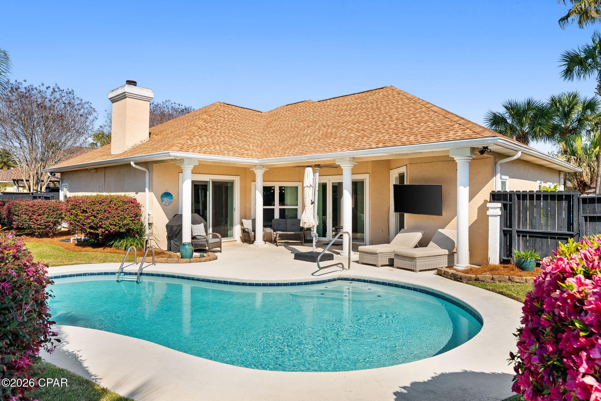 CURRENTLY UNDER CONTRACT, SELLER WILL CONSIDER BACKUP OFFERS Welcome to Palm Bay! This modern and inviting pool home is located close to the entrance with easy and quick access to the beach, shopping and restaurants. The beautiful landscaping and palm trees create a coastal vibe while relaxing out by the pool and patio area that is sure to impress. The home has been renovated with style, has a space for everyone and offers seamless indoor-outdoor flow. With tasteful lighting throughout, LVP flooring, a fireplace, updated impact doors and windows that allow lots of natural light and custom window treatments, this beach house is move in ready for its new owner. 
The spacious primary suite has sliding glass doors that lead to the pool and patio area.  The primary bathroom includes a large walk in closet and has been renovated with a custom tile shower, soaker tub, quartz countertops with double vanities and a private water closet. The split bedroom floor plan includes two bedrooms and a bath with an additional two bedrooms that can be used for dining, office or play room as well. 
The open floor plan is great for entertaining with sliding glass doors that lead from the living area straight to the patio and pool area. The kitchen offers stainless steel appliances and has been renovated with modern quartz countertops, wood cabinets, gorgeous hickory island and venthood and a custom pantry for ample storage.  This home has so much to offer and some extra features include two car garage, ring doorbell system, washer and dryer, roof (2020), new well pump for irrigation system with wifi control, privacy fence, natural gas hookup for grill area, close proximity to the mailbox area, built in book shelves and cabinetry in the living room, hybrid heat pump water heater (2021) and many more. Don't miss your chance to enjoy beautiful sunsets out by the pool in your own back yard! All information deemed important to be verified by the buyer.