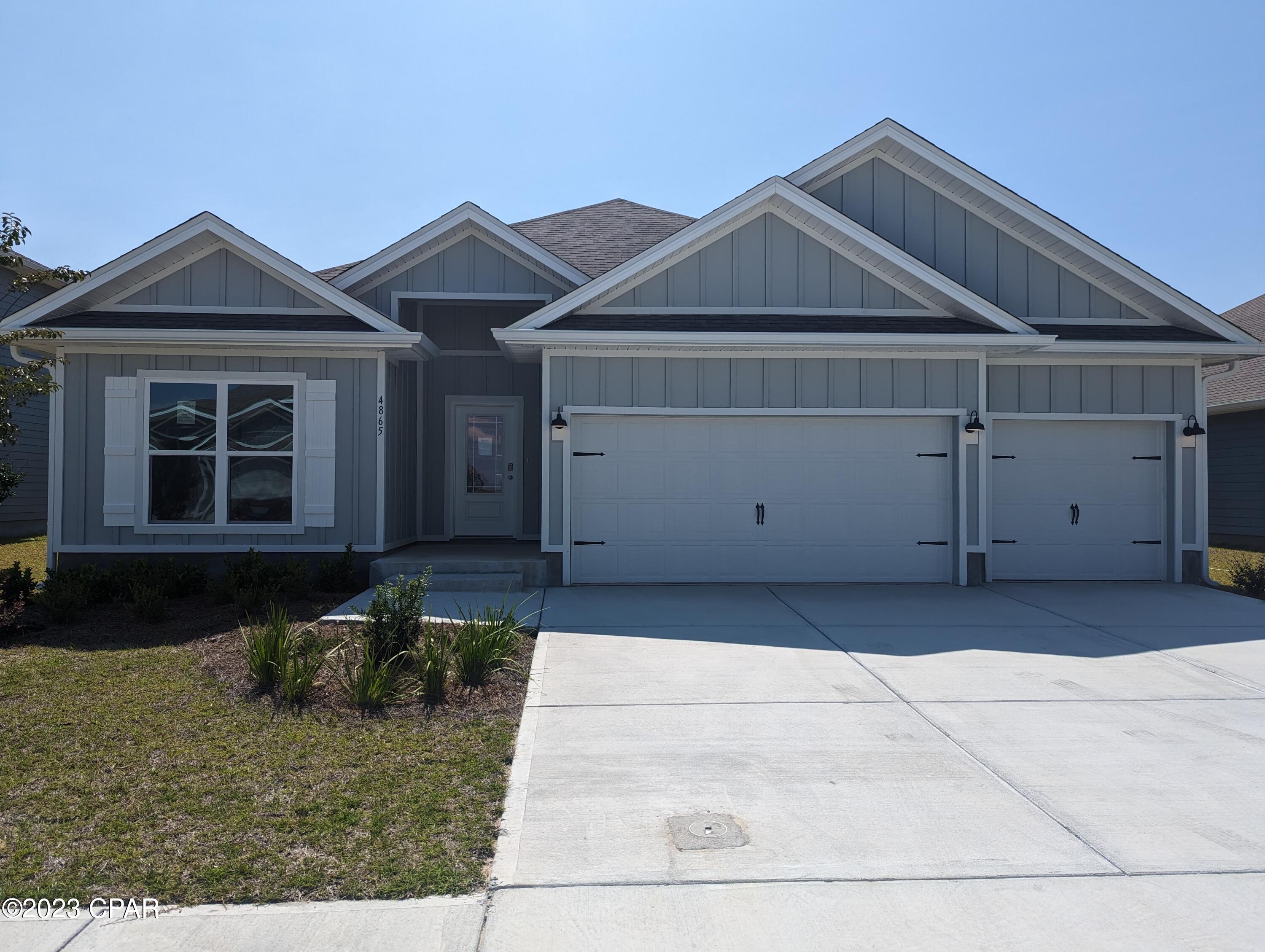 The Destin is a single story detached home that is in the highly desirable community of Titus Park. Located on the north east side of Panama City, Titus Park is a short drive to downtown Panama City, the Gulf of Mexico with sugar sand beaches, Tyndall Air Force Base, shopping, dining, and more! The home has a private entrance with concrete pathway, steps, and designer landscaping. Inside, you are warmly greeted by engineered vinyl plank floors that lead to a bright and open floor plan seamlessly connecting the kitchen to the living room and leading to the inviting, sunny backyard. Meticulous attention to detail is presented in the kitchen with granite countertops, white cabinetry with brushed nickel knobs, and stainless steel Whirlpool appliances which includes the following: stove, dishwasher, and microwave.   A 10' tray ceiling with beautiful crown molding gives the living area have a very open feel. The 1st bedroom is located directly off of the living area and also features a tray ceiling with crown molding, and a bathroom featuring a double vanity, large shower, full size soaking tub, and a walk in closet. There are 3 additional bedrooms located adjacent to 2 other full bathrooms. The back patio is a wonderful entertainment space for family and friends. There is more than ample storage available in the 3 car garage. New homes in Titus Park also feature a smart home system that includes a KiwkSet Keyless Entry, Skybell doorbell, automated front porch lighting, an Echo Dot, and a Qolsys touch pad, and customizable LED lighting.