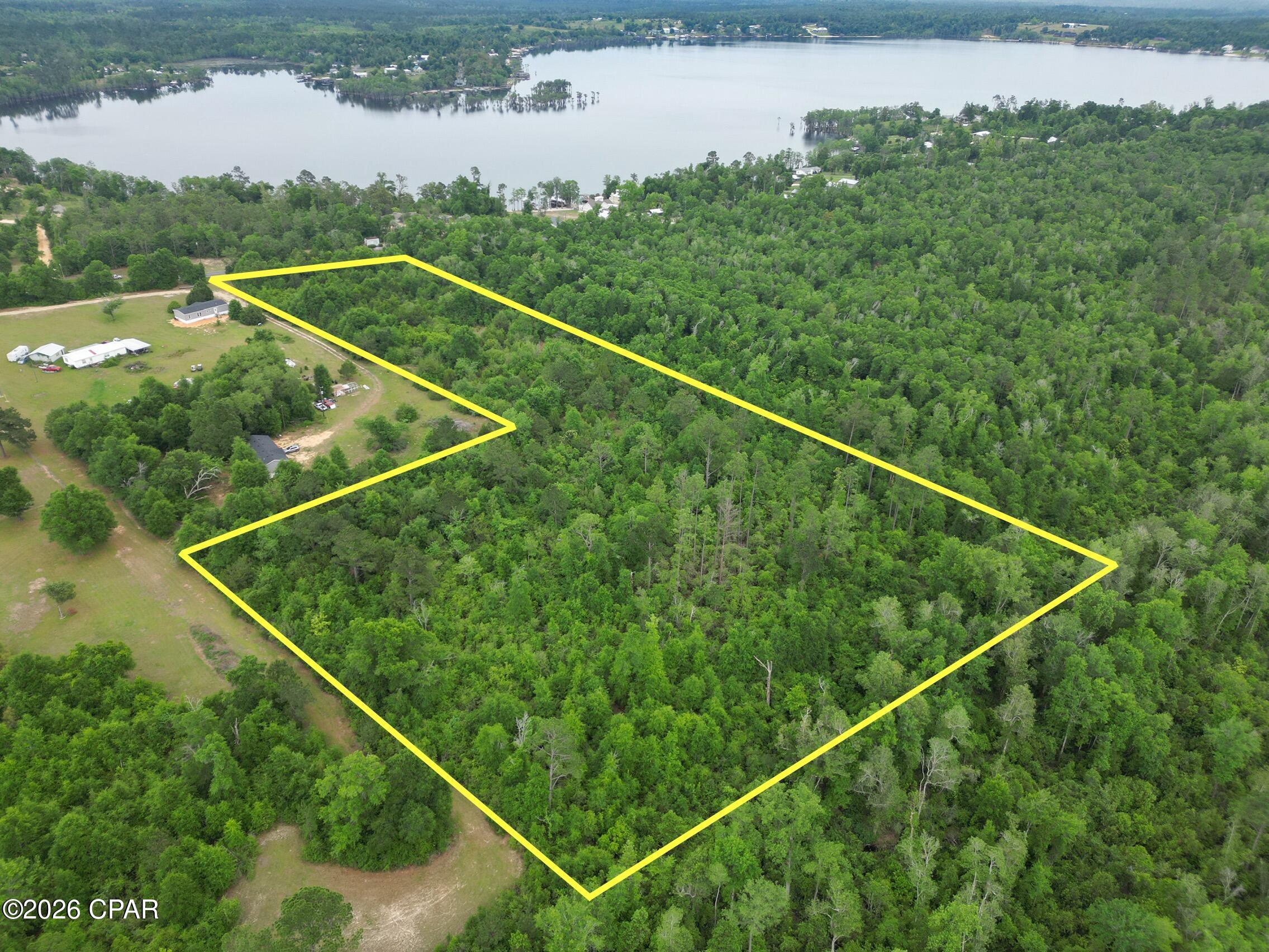 Discover the perfect opportunity to own 10.48 acres on Lakepoint Road in Alford, ideally located just across the street from beautiful Compass Lake and only a short walk to the water. This expansive property offers the perfect setting to build your dream home, weekend retreat, or private getaway surrounded by the peaceful beauty of nature. Enjoy the tranquility of country living while still having convenient access to nearby recreational amenities including fishing, boating, swimming, and more. With plenty of space to create your ideal homesite, this property offers endless possibilities in a highly desirable area near Compass Lake in the Hills. Don't miss your chance to own a slice of Florida paradise!