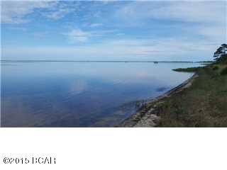 1.2 ACRES PLUS!! Large 100'MOL bay front lot on the north end of the Cape. Only a few steps (80') from the state park boundary. Rare sandy beach and NO MARSH GRASS on the shoreline. Just start walking into the pristine waters of St. Joe Bay. Light building restrictions and NO HOA!! Very private area. SELLER WILL PAY FOR FINAL SURVEY. Measurements are estimated. Parcel is part of Parcel ID #'s-06345-087R and 06345-088R