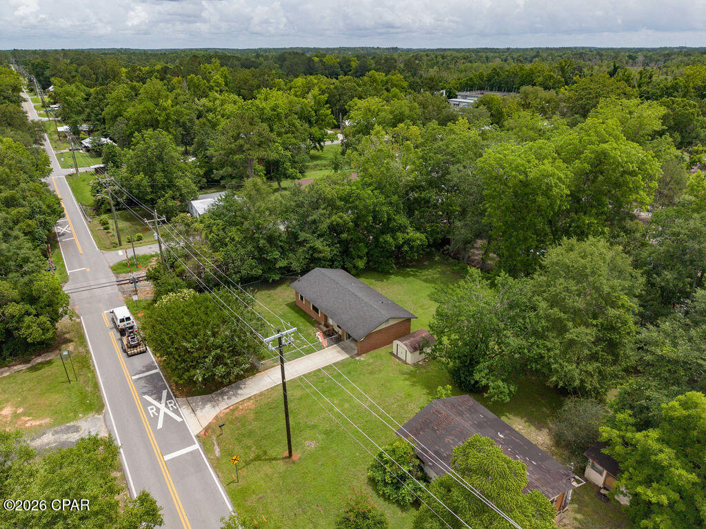 Packed with charm and ready for its next owner! This 3-bedroom brick home sits on a spacious, fully fenced lot in the City of Bonifay and offers comfort, convenience, and room to grow. The open living, dining, and kitchen area creates an easy-flow floor plan perfect for everyday living.
The living room provides plenty of space to relax, while the cozy country kitchen feels like home the moment you walk in. The finished garage features sheetrock, an automatic garage door, and endless possibilities for a game room, home office, workout space, or additional living area.
You'll also appreciate the laundry room with utility sink, concrete driveway, and metal storage building for all your extra storage needs.
Located on a paved street near the edge of town, you'll enjoy the convenience of nearby amenities while still having space to spread out. Homes this neat, clean, and move-in ready don't stay available long--schedule your showing today! This is a great price for a great home.