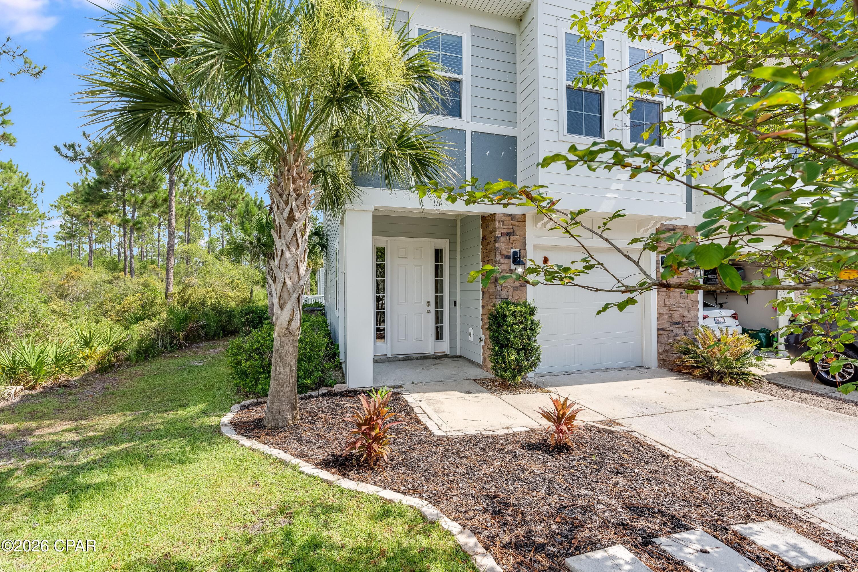 Available early July! Beautiful, well-maintained 3-bedroom, 2.5 bathroom end unit townhome with spacious 1 car garage with built in overhead storage, conveniently located just minutes from NSA Navy Base, Pier Park, and the most beautiful beaches in the world. This two-story townhome end unit borders forest, with peaceful nature views and ample natural light. The home features LVP flooring throughout and carpeted bedrooms, Nest thermostat-controlled AC & heating (brand new HVAC replaced 2023), ceiling fans, and stainless appliances in the kitchen. Washer and dryer included. Fenced-in backyard with patio, weekly landscaping provided by HOA. Security features include keypad door lock and Ring doorbell camera. Amenities include access to the clubhouse with a resort-style community pool. Very private, situated in a quiet and family-friendly neighborhood within a 5-minute drive from Publix, Home Depot, CVS, and the beach. Property sizes and ages are approximate, please measure and/or verify if important. School assignments are subject to change, please check with Bay County for most accurate information. Deposit is the same as the rent. Pets allowed with owner approval, a NON REFUNDABLE pet fee per pet applies. Breed restrictions apply.