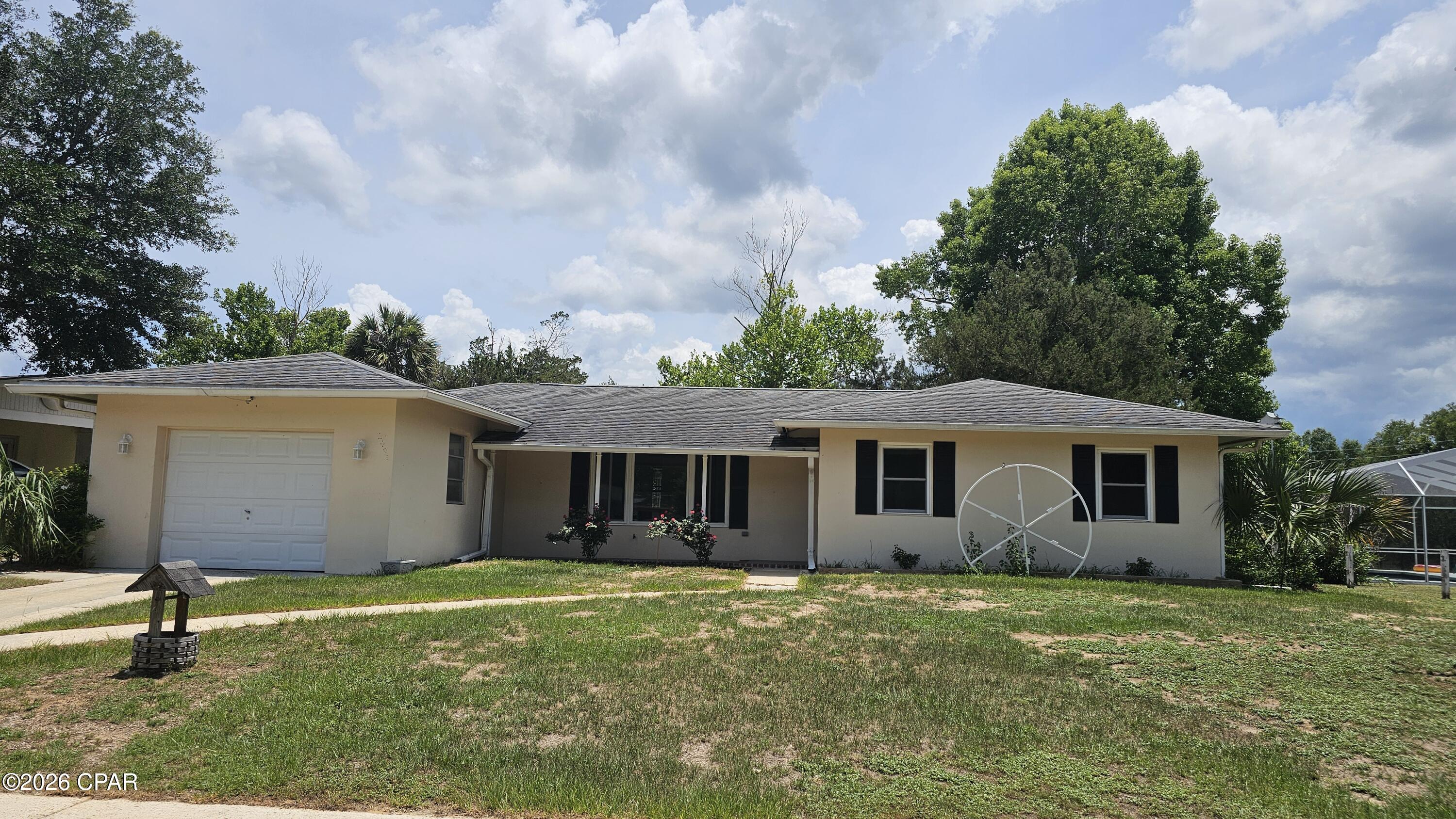 East! Breezy! Treesy! Deltona solidly built (concrete block/stucco) 3/2 on nice, quiet Sunny Hills street, right off the boulevard. Ready to make your own. Home features big living room opening to very large tiled Florida room with lots of windows to provide amazing view of treesy back yard. One of the nice things about this property, being on sort of a circle, is the backyards back up to each other, providing a green, lush look. No looking out back just to stare at the back of your neighbor's house! This home is waiting for you to make it your own. Solidly built, insured, and ready to move in. Join the fast-growing and desirable Sunny Hills community. You're off the main drag and free from much traffic, yet in two minutes you can access Hwy 77 to head south to Panama City Beach or north to Chipley and I-10. We have plenty of amenities in Sunny Hills, such as popular Boat Lake Swim & Recreation Park, Wilder Skate Park with large pavilion and pickle ball court, not to mention our own branch of Washington County Library. This is the time to invest your life in Sunny Hills, as values are anticipated to keep heading north. To see this home, call your favorite Realtor Right Now! [[ PS Home is also available to rent! ]]