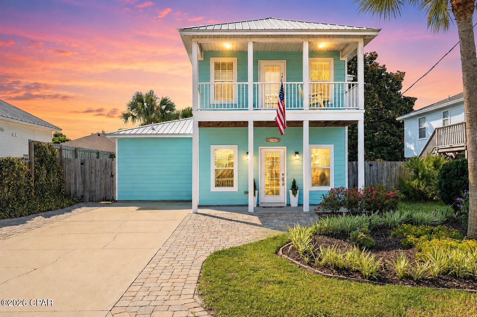 Coastal charm, thoughtful upgrades, and a rare private beach lifestyle come together in this beautifully maintained Key West-style home in the highly sought-after Bid-A-Wee Beach community. With exclusive gated beach access and just two blocks from the Gulf, this 2014 residence captures the ease, durability, and quiet luxury of true coastal living.

Inside, the home offers a desirable first-floor primary suite featuring a double vanity and direct back patio access to the backyard. The kitchen balances style and function with high-end stainless steel appliances, induction stove, granite countertops, a large center island, and built-in pantry shelving that adds both charm and practical storage. Also on the main level, the bright, open layout and bonus half bath make entertaining effortless. Upstairs, you'll find hardwood flooring throughout, along with two additional bedrooms, each offering an en suite bathroom and walk-in closet.

Outdoors, the lifestyle truly takes center stage. Lush tropical landscaping surrounds a private backyard retreat, complete with an outdoor shower that's perfect for rinsing off after a day at the beach before stepping back into comfort. The extended patio and fully fenced yard create the perfect post-beach sanctuary for grilling with friends, unwinding in the hot tub, or enjoying warm coastal evenings under the stars. Topped with a low-maintenance metal roof, this home also comes with no HOA dues and no required flood insurance. A spacious outdoor storage shed keeps beach gear, gardening tools, and seasonal items neatly tucked away. And don't forget to enjoy a glimpse of the Gulf every time you head out to check the mail.

From this exceptional location, you're perfectly positioned to enjoy everything Panama City Beach has to offer. Just minutes away are the newly opened TopGolf, Pirates Voyage Dinner & Show, World Famous Tootsie's Orchid Lounge, and 810 Billiards & Bowling. You'll also be approximately 2 miles from Pier Park, 8 miles from St. Andrews State Park, 12 miles from 30A, and 15 miles from Northwest Florida Beaches International Airport.

Homes in Bid-A-Wee that offer modern construction, thoughtful updates, a straight shot to the Gulf, and easy access to the best of Panama City Beach are a rare find. Schedule your private showing today and discover your own beachside escape.
