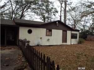 REDUCED!!!  Expanded three bedroom two and half bath cottage with one car garage in a rural setting next to a major highway, and Dollar General Store offered as is as is. The property needs some TLC but has loads of potential. All sizes are approximate or takenfrom other sources please verify accordingly