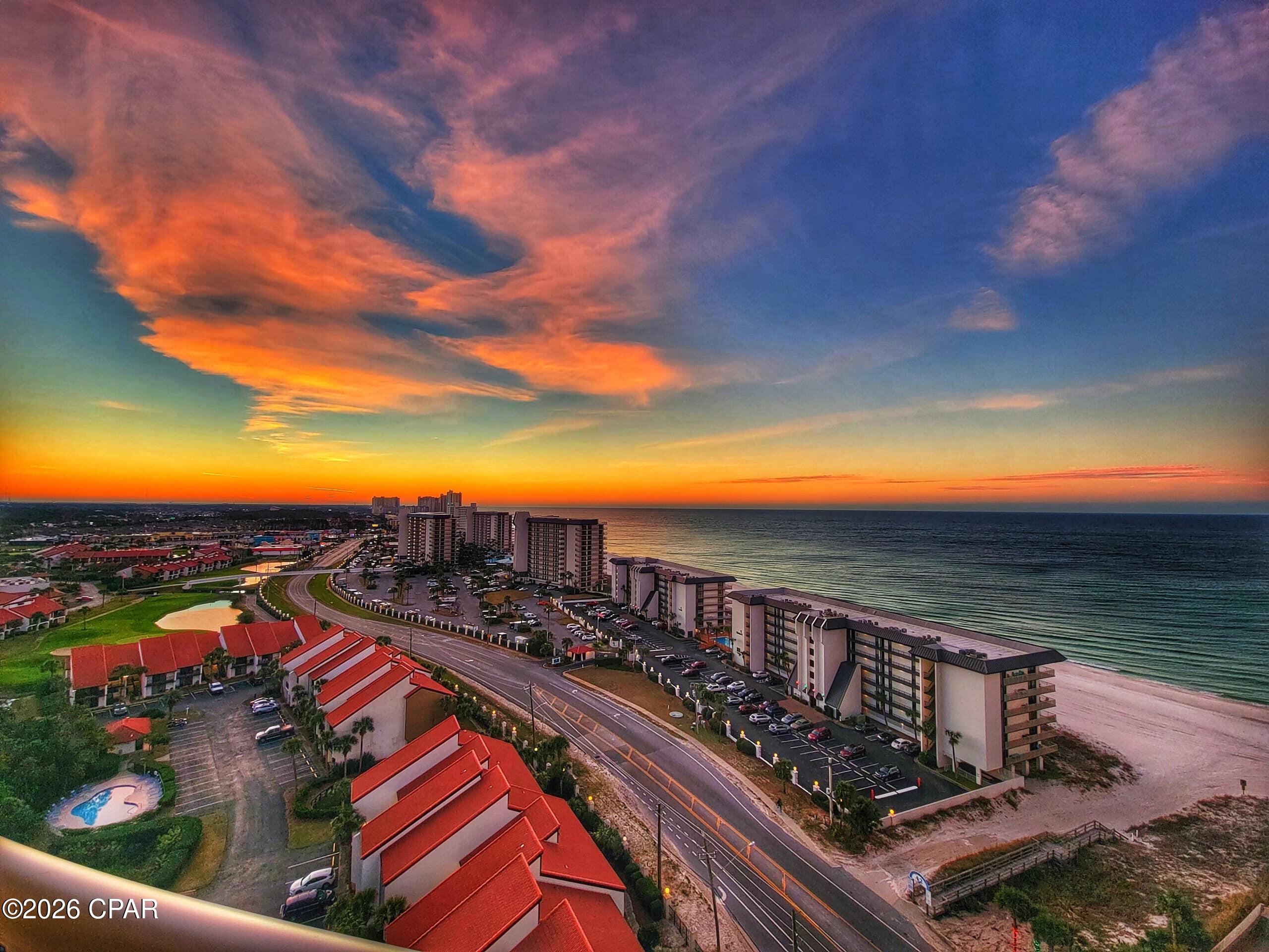 $60,969 in revenue June '25 to May '26: an 18.0% ROI on the asking price! One of the largest and most flexible floor plans at Grand Panama Beach Resort, this spacious 903-square-foot 1-bedroom-plus-bunk-alcove offers two full bathrooms and sleeps six, living far bigger than the typical beach condo. From the 10th floor of Tower 2, a covered private balcony captures sweeping Gulf and main-strip views, the perfect perch for morning coffee or a sunset cocktail. Inside, the king master is a true retreat, with an electric fireplace glowing beneath a wall-mounted TV and an en-suite bath featuring double granite vanities and an oversized walk-in shower, while a second full bathroom, a built-in bunk alcove, a queen sleeper sofa, and two recliners make the open-plan living area endlessly flexible for families and groups. The kitchen is full granite, and there is an in-unit washer and dryer. Grand Panama Beach Resort delivers a beachfront free-form pool and a heated rooftop pool atop Tower 2, hot tubs, a seasonal beachside tiki bar, a large fitness center, covered garage parking, an elevated enclosed sky-bridge to the beach, and a hotel-style lobby, while the HOA covers building insurance, water and sewer, cable, and internet for predictable ownership costs. Grand Panama also has storage lockers for owners, and this unit will convey with four of them. Best of all, about 37% of its revenue already comes from direct and repeat bookings, well above the Panama City Beach market average. As an added bonus, the seller's revenue consultant will personally assist the buyer in expanding the property's direct-booking strategy through modern AI, automation, and data-driven revenue management techniques. Space, a second full bath, sleeps-six flexibility, and proven cash flow, all just minutes from Pier Park and Panama City Beach's most popular attractions. Full rent roll available to qualified buyers.