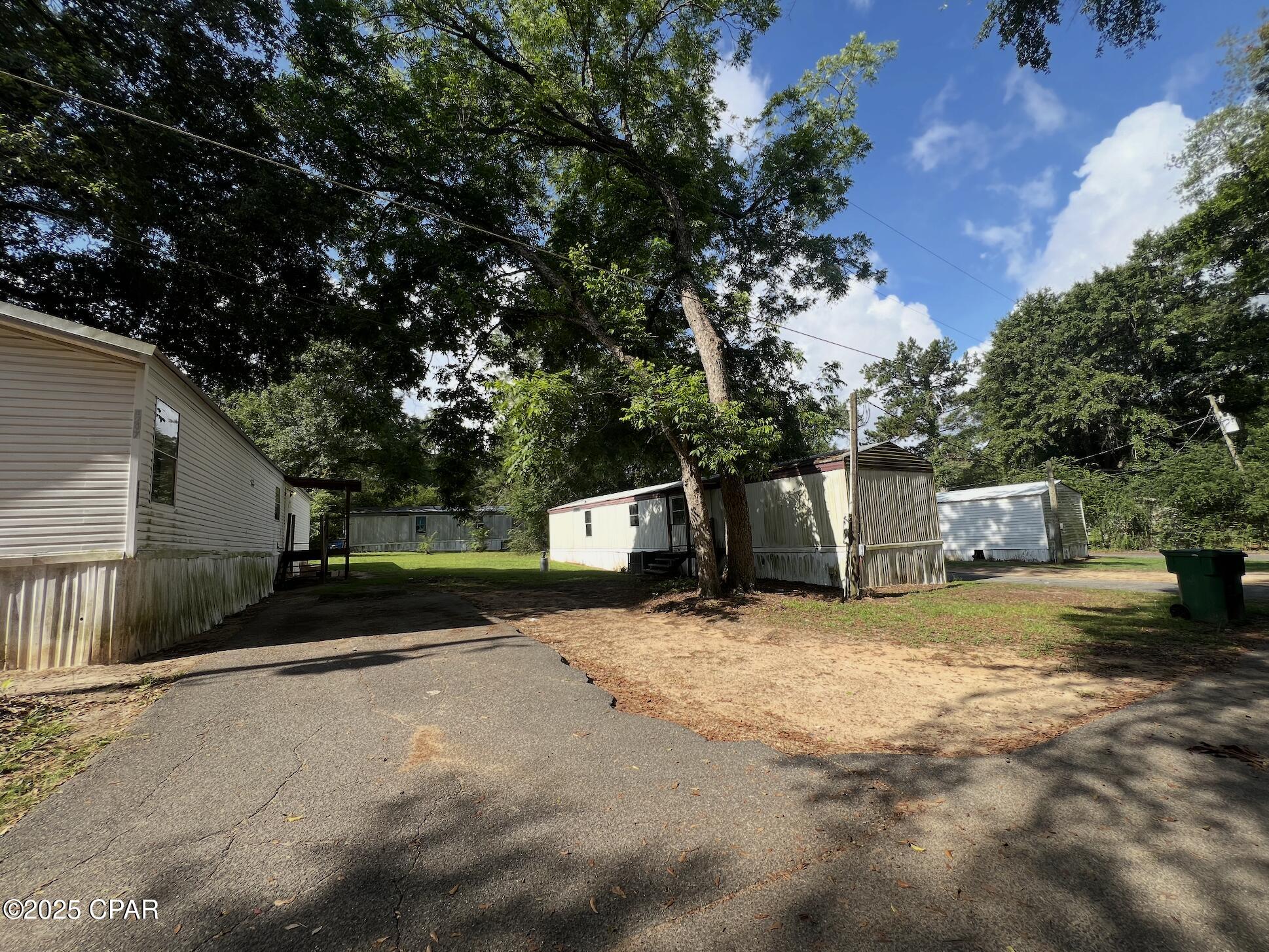 Welcome to Friendly Acres, an income producing mobile home park with 19 homes only 5 minutes from downtown Marianna, FL. Seller Financing available with $500,000 down, 5% interest, with a balloon in 5 years. Situated on 9 acres, this park features fifteen 3 bed/2 bath homes, one 3/1.5 home, and three 2/1 homes. All homes are currently occupied and generating $14,475 per month. Many homes are leased below market rent creating an easy opportunity to raise cashflow. All homes had new metal roofs installed in 2019. There are 2 wells on the property with one having a new pump and tank installed in 2024 with the other well having the same work done in ~2020. There are approximately 15 septic tanks. There is city water located across from Fieldstone ct, making it a possibility to hook up to in the future. The current owner enjoys very low expenses with an expense ratio of 8.5%.