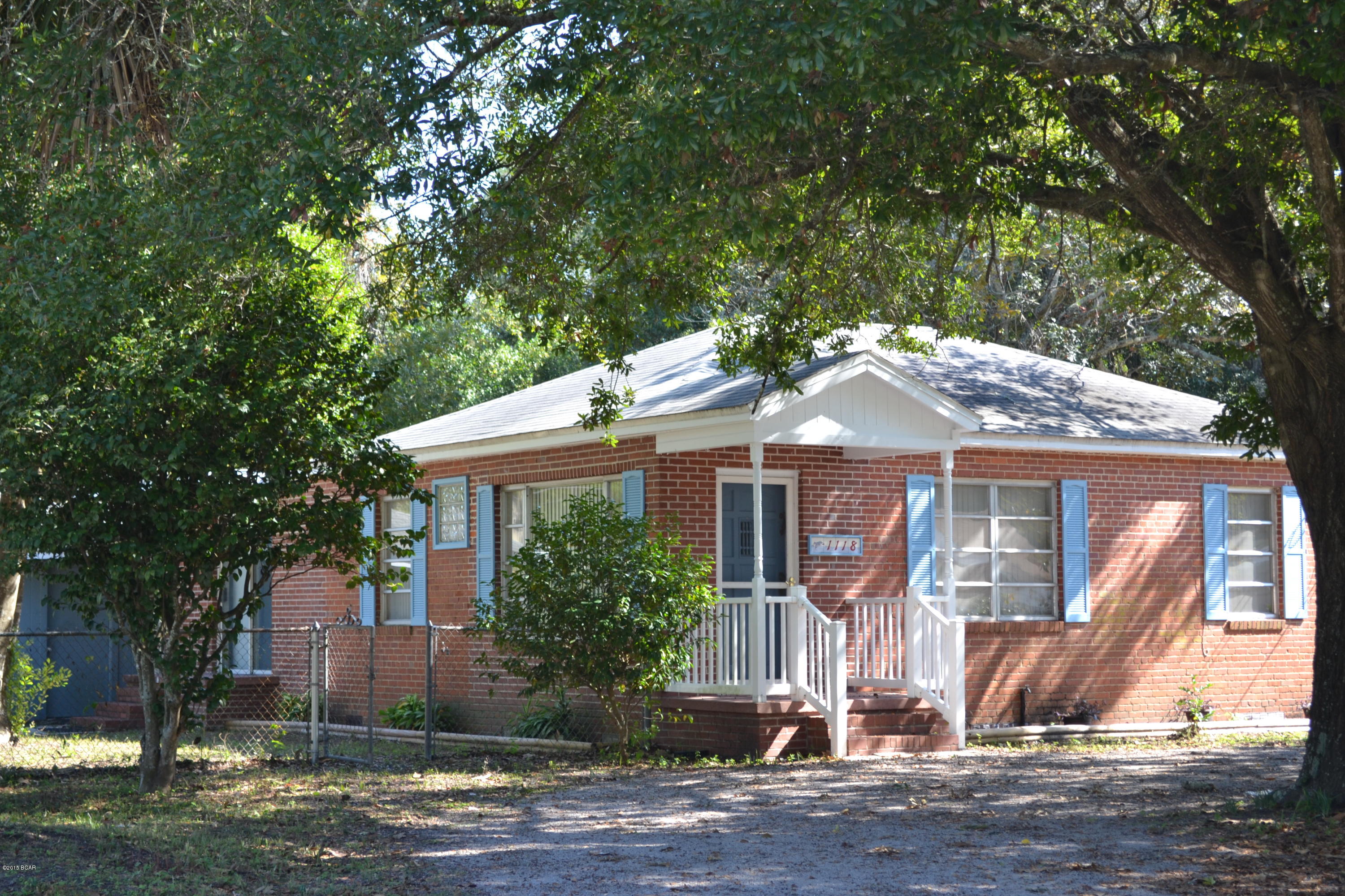 Motivated Seller! All brick Florida Cottage with 3 bedrooms and 2 full baths.  Located in St. Andrews close to the bay and Oakland Terrace Park.  This home  features wood floors with a split bedroom plan and lots of natural light.  The master bedroom is spacious and has its own full bath.  There is  room to spread out in the large kitchen which has an island, pantry, gas stove, side by side refrigerator and sliding door to the fenced side yard. Also included are a stacked full size front loading washer and dryer with inside hook up. The dining area even has a  corner banquette. The home is on a fenced corner lot with a large detached 2 car garage with 110 power for a workshop, game room, etc. and a washer dryer hook up if the laundry wanted to be relocated.