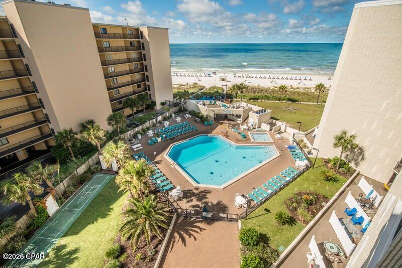 Updated ground-floor studio condo at Top of the Gulf with a private patio! This condo offers an exceptional blend of modern coastal style and short-term rental opportunity,  Beautifully renovated, the condo showcases a fresh, contemporary interior with upgraded tile flooring, granite countertops in both the kitchen and bath, high-end soft-close cabinetry, a custom tiled walk-in shower, designer fixtures, updated furnishings, and a cozy fireplace feature that elevates the guest experience. Major system improvements include an updated HVAC system, hot water heater, appliances, and an enhanced owner's storage closet, creating a true move-in or rent-ready opportunity. One of the most desirable features of this residence is its rare ground-floor location with a private patio, exclusive to ground-floor units. Enjoy the convenience of stepping directly outside to your own garden-style outdoor space, ideal for morning coffee, relaxing after a beach day, or accommodating pet-friendly owner use in accordance with association rules. Guests and owners alike will appreciate the easy walk-out access to the Gulf-front pool, sugar-white sand beaches, and resort amenities without ever needing to use an elevator. Whether you are seeking a vacation rental, a personal beachfront retreat, or a low-maintenance investment property, this condo delivers exceptional versatility and value. Top of the Gulf offers an array of amenities including a Gulf-front pool, game room, BBQ and picnic areas, beach showers, snack bar, owners' lounge, and on-site management, all within one of Panama City Beach's most recognizable beachfront destinations on Thomas Drive.